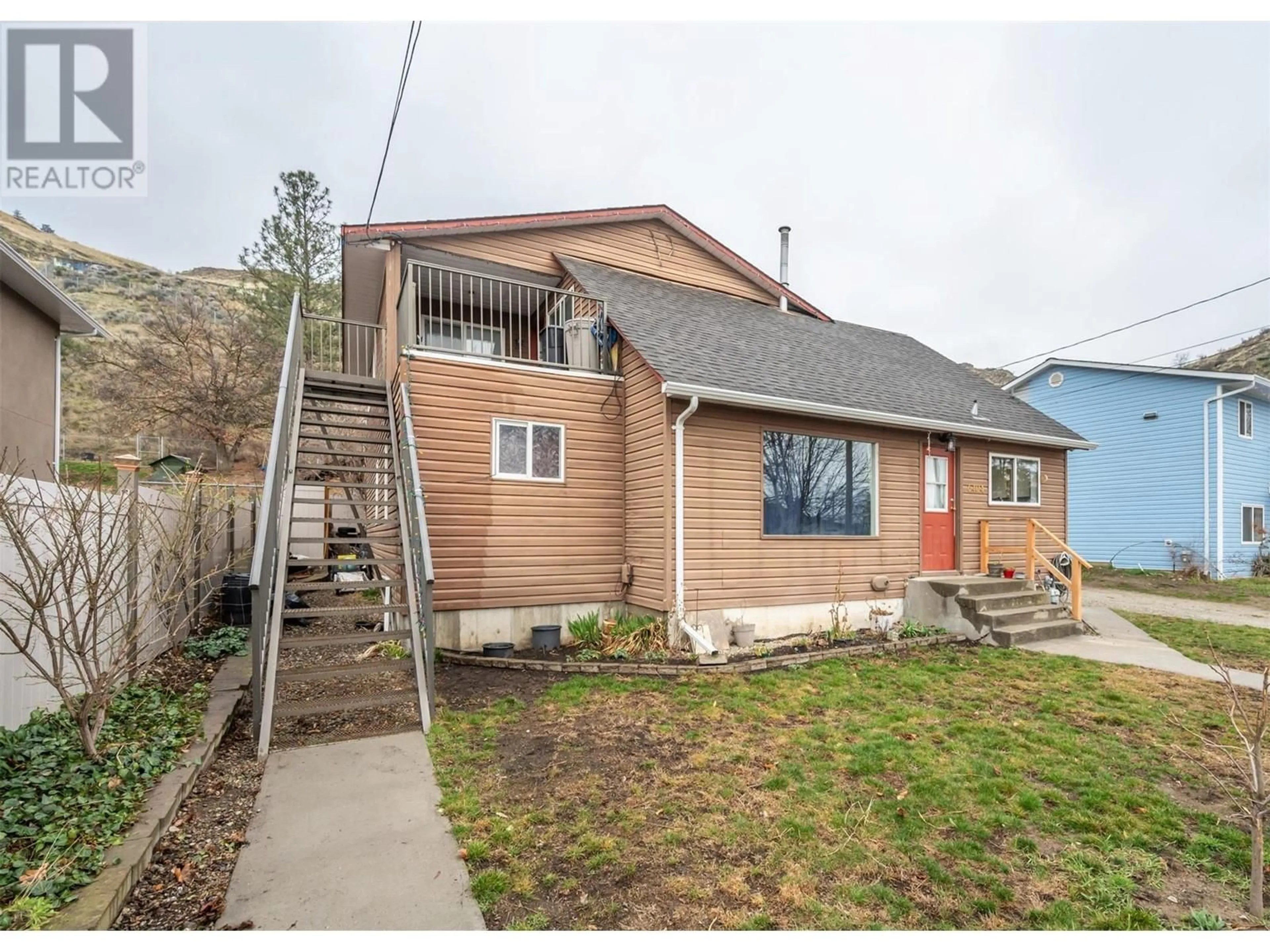 Home with vinyl exterior material, street for 6404 SPARTAN STREET, Oliver British Columbia V0H1T6
