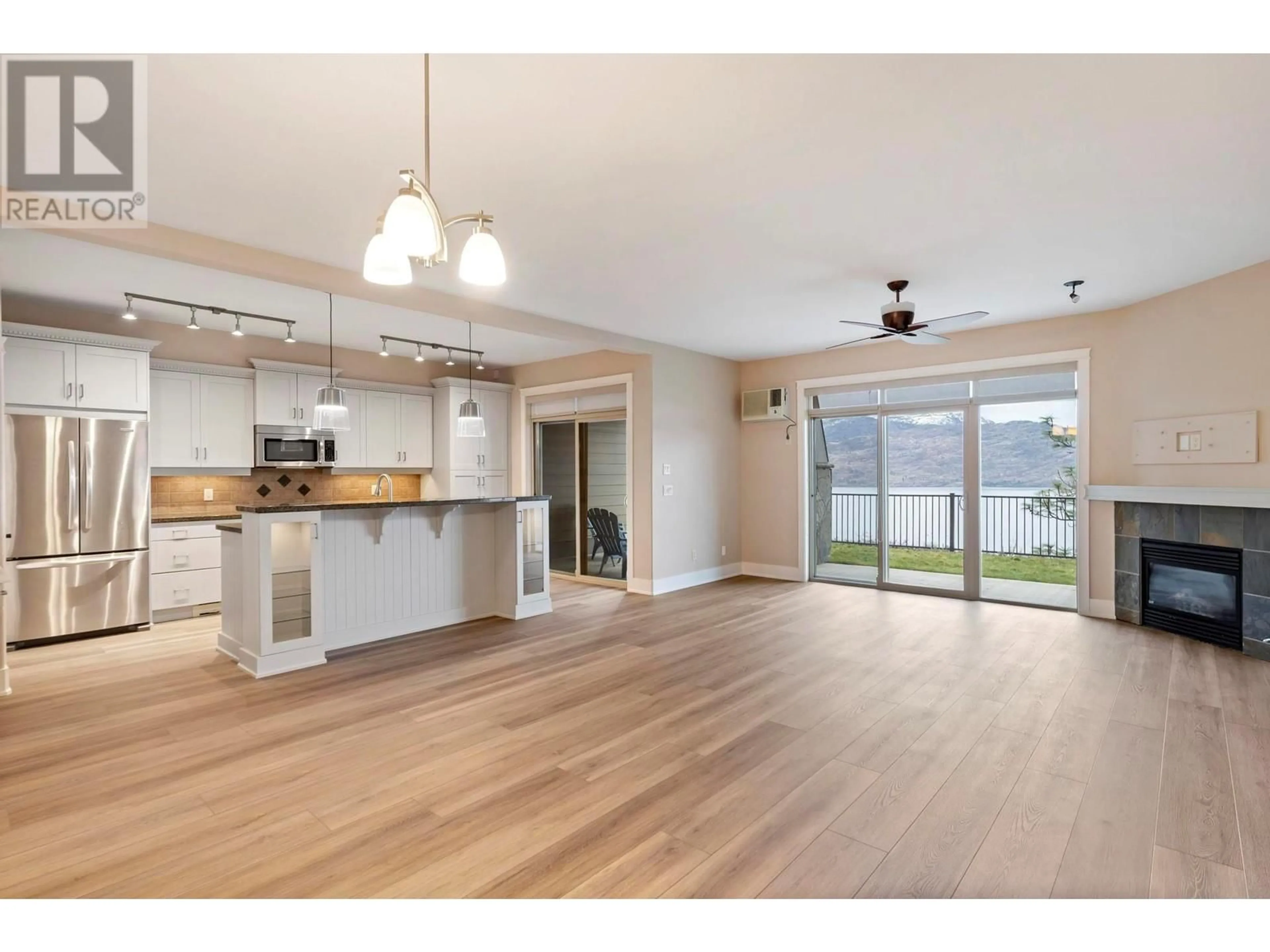 Open concept kitchen, wood/laminate floor for 114 - 4350 PONDEROSA DRIVE, Peachland British Columbia V0H1X5