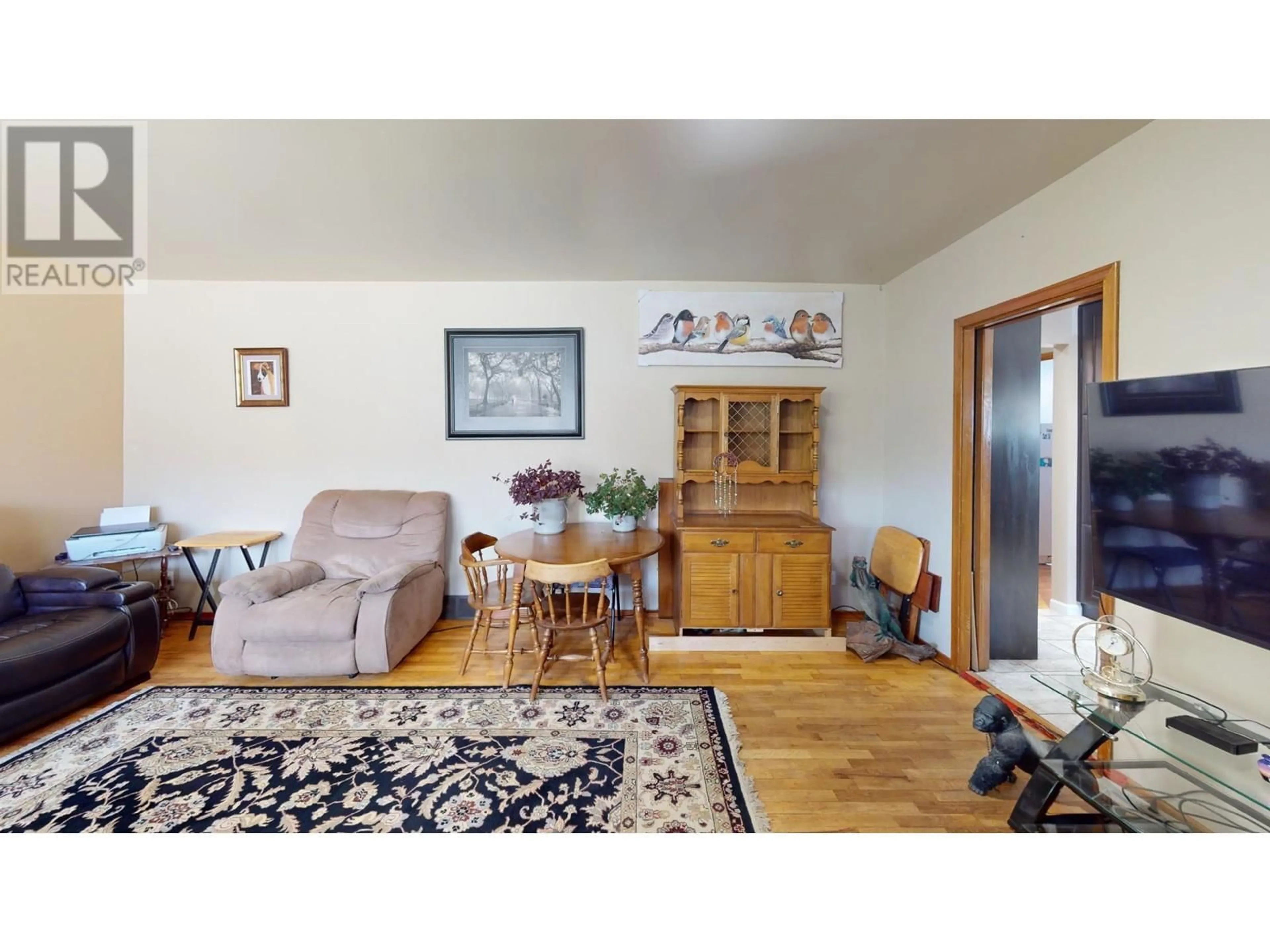 Living room with furniture, wood/laminate floor for 138 HAIG STREET, Warfield British Columbia V1R2L9