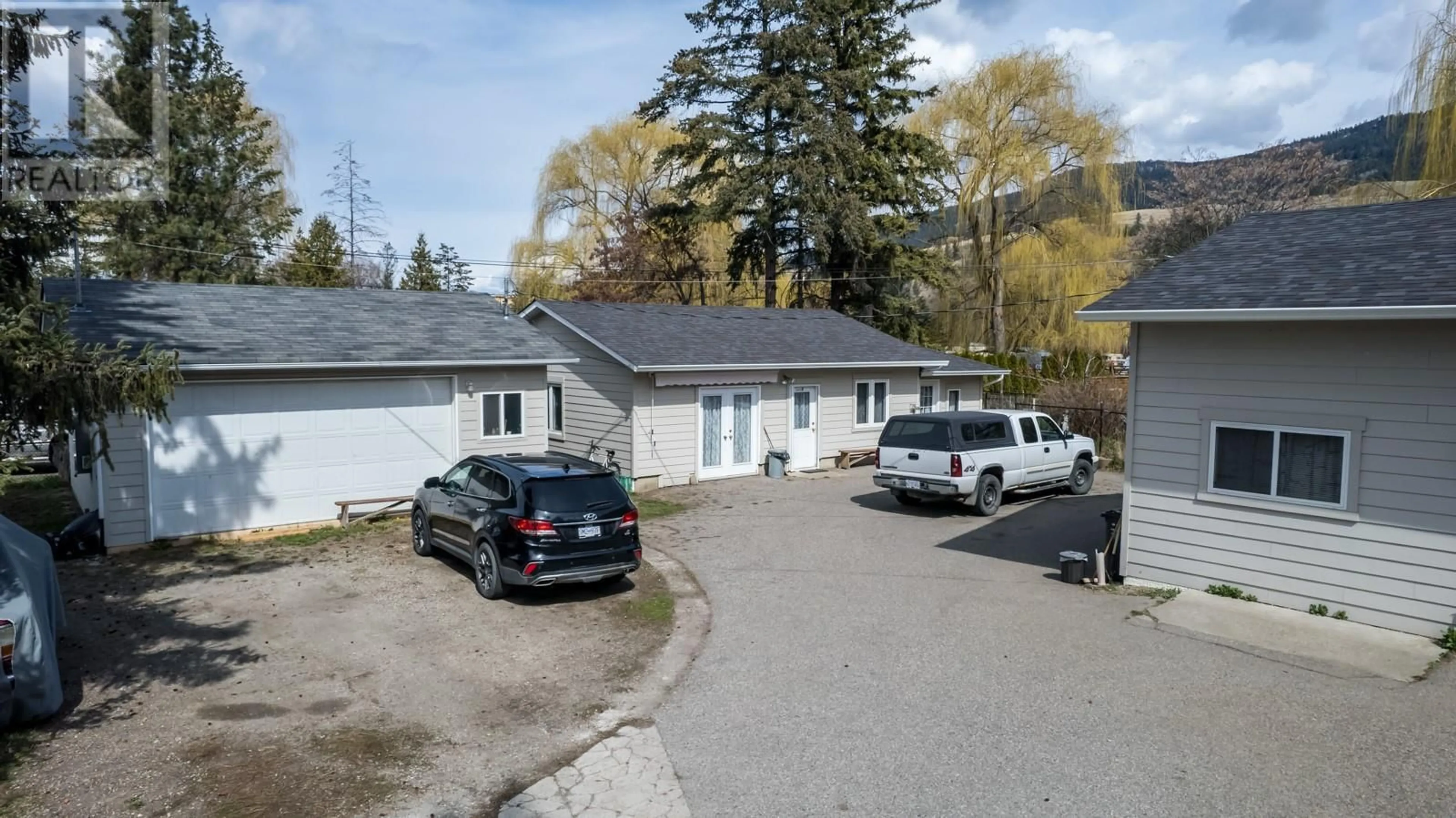 A pic from outside/outdoor area/front of a property/back of a property/a pic from drone, street for 11375 REISWIG ROAD, Lake Country British Columbia V4V1Y5