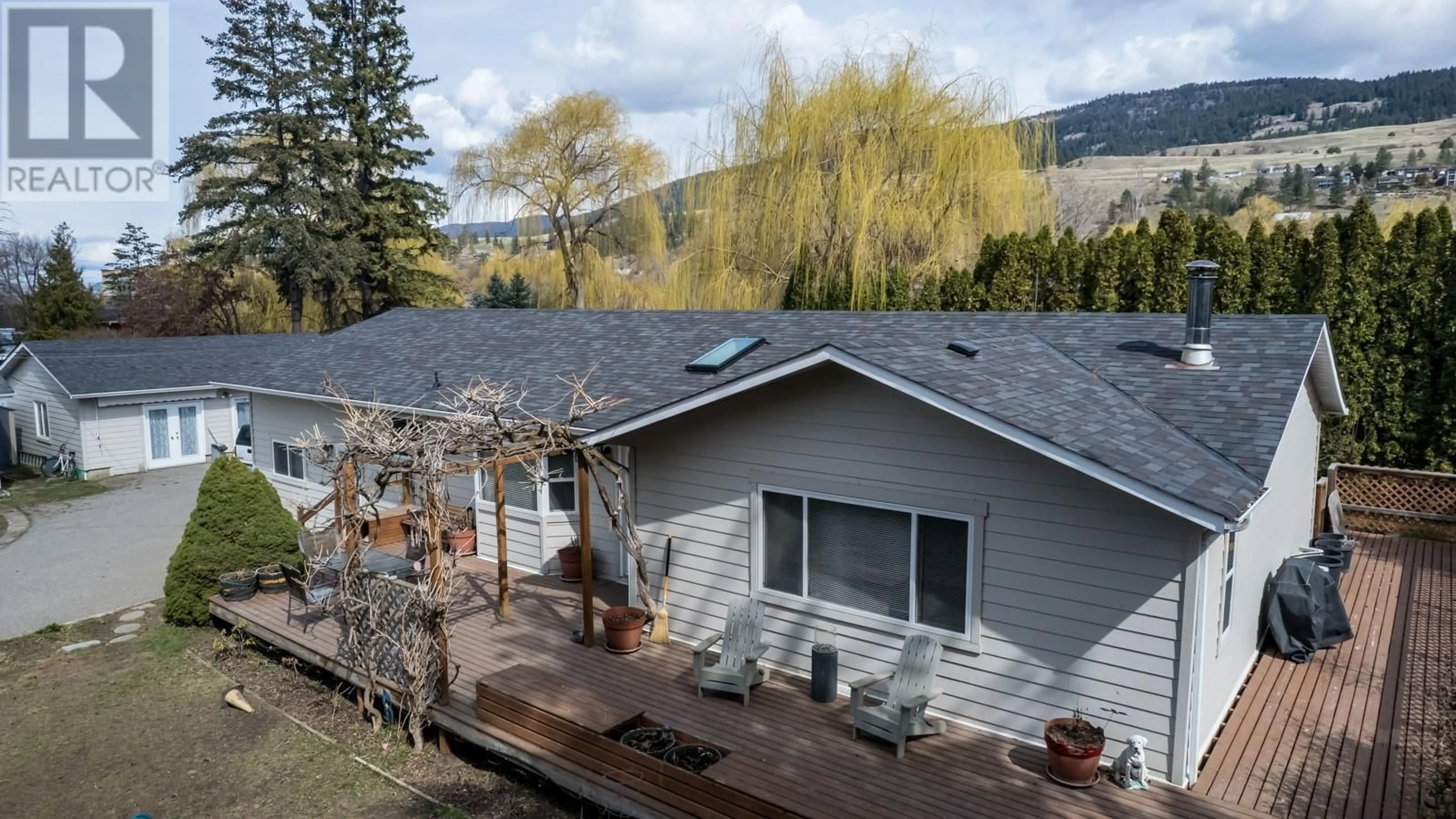 A pic from outside/outdoor area/front of a property/back of a property/a pic from drone, mountain view for 11375 REISWIG ROAD, Lake Country British Columbia V4V1Y5