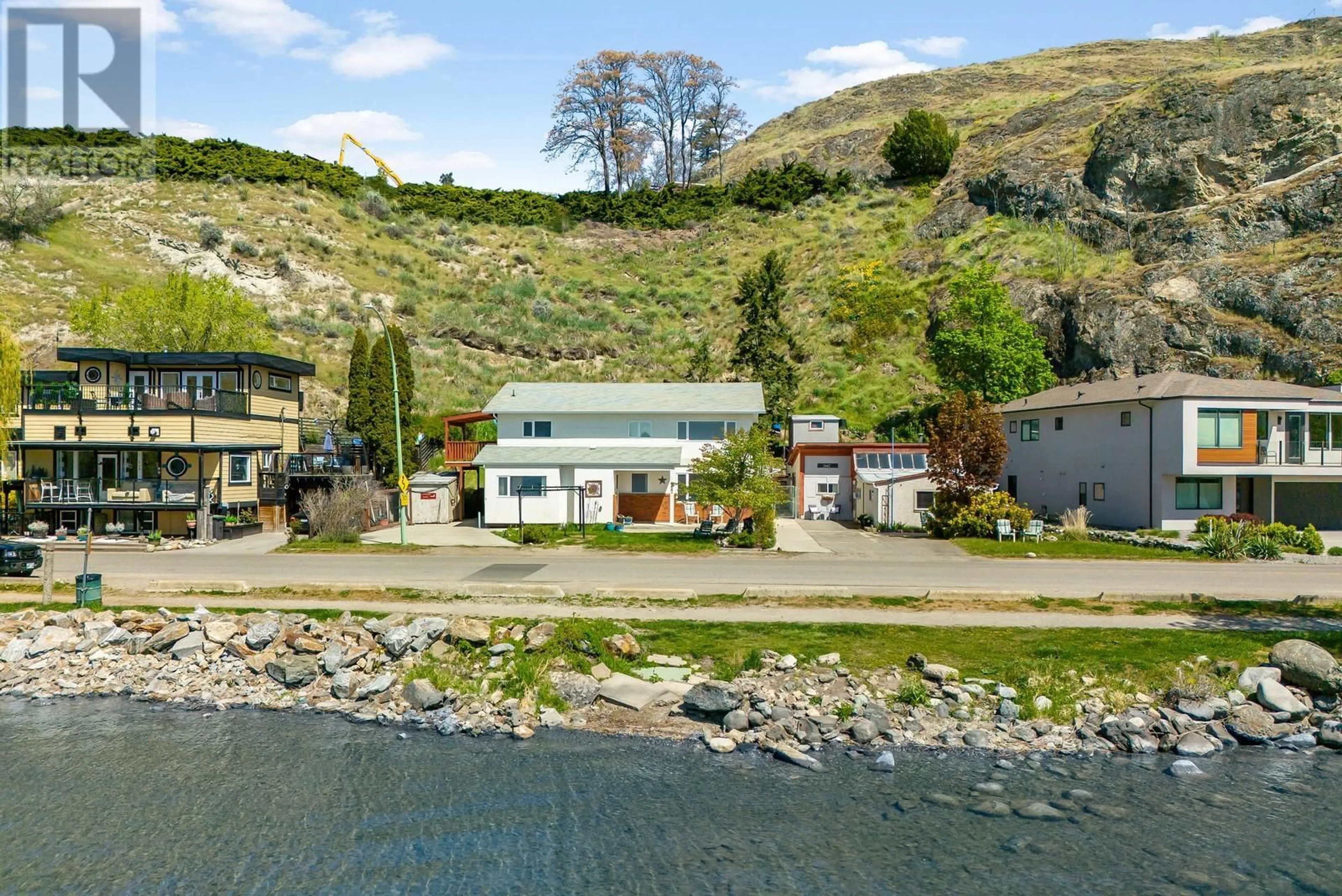 A pic from outside/outdoor area/front of a property/back of a property/a pic from drone, water/lake/river/ocean view for 457 POPLAR POINT DRIVE, Kelowna British Columbia V1Y1Y2