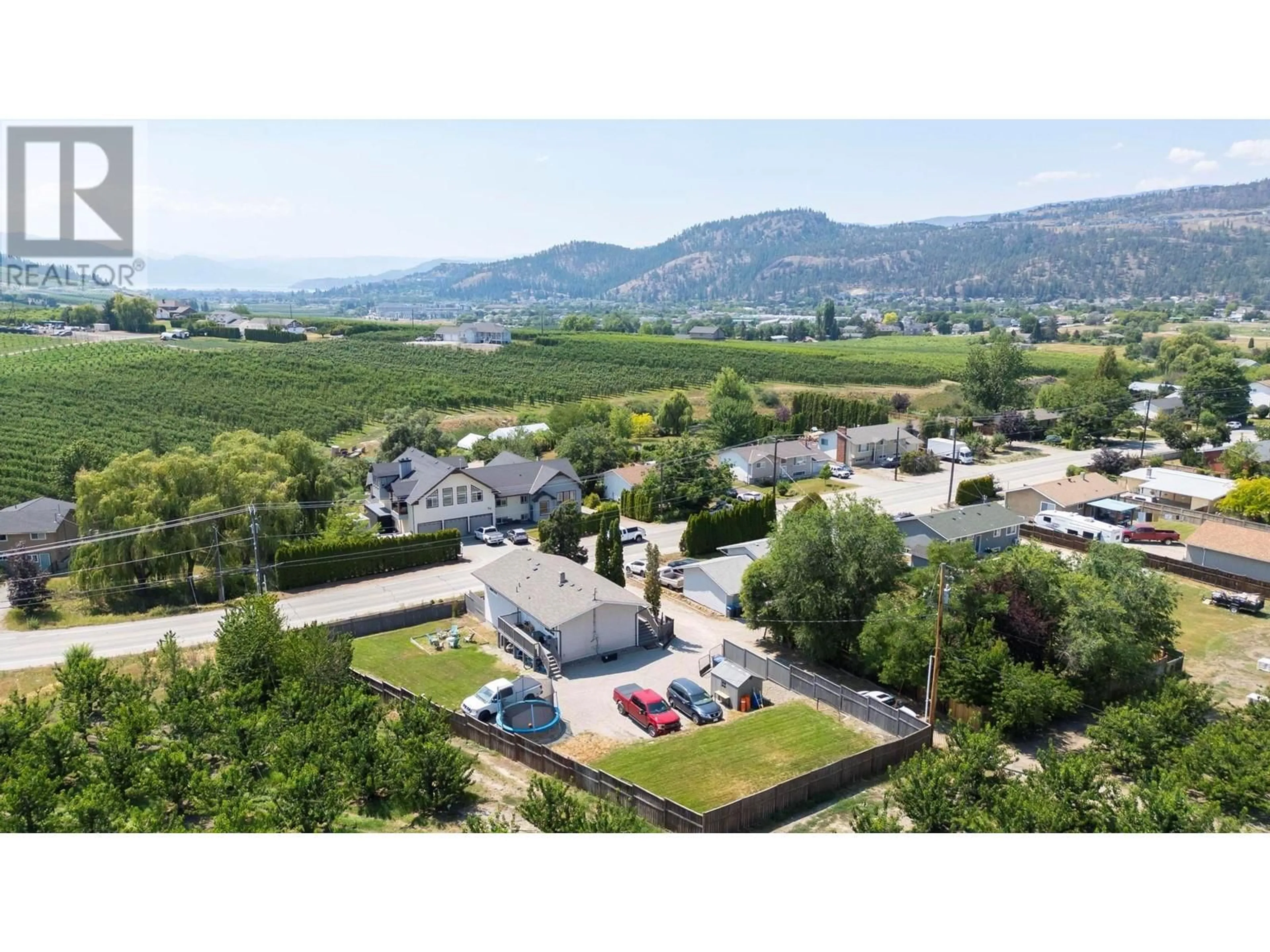 A pic from outside/outdoor area/front of a property/back of a property/a pic from drone, mountain view for 2490 SEXSMITH ROAD, Kelowna British Columbia V1V2E9