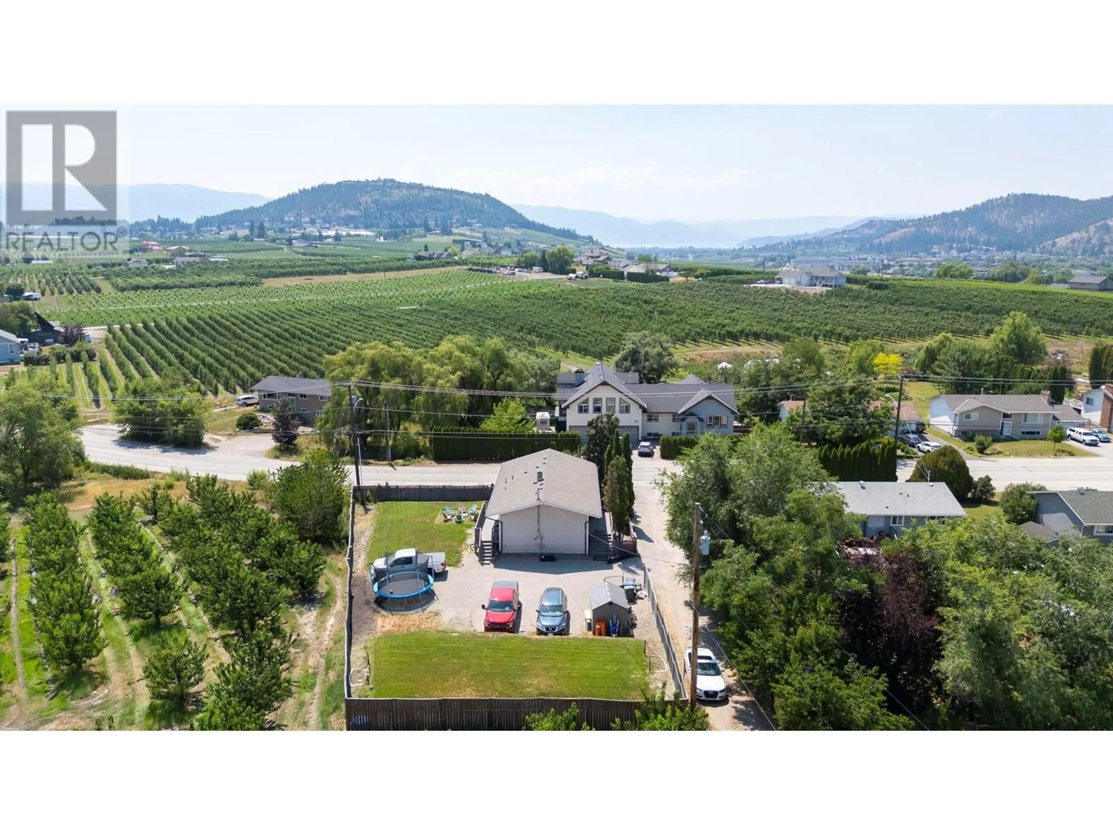 A pic from outside/outdoor area/front of a property/back of a property/a pic from drone, mountain view for 2490 SEXSMITH ROAD, Kelowna British Columbia V1V2E9