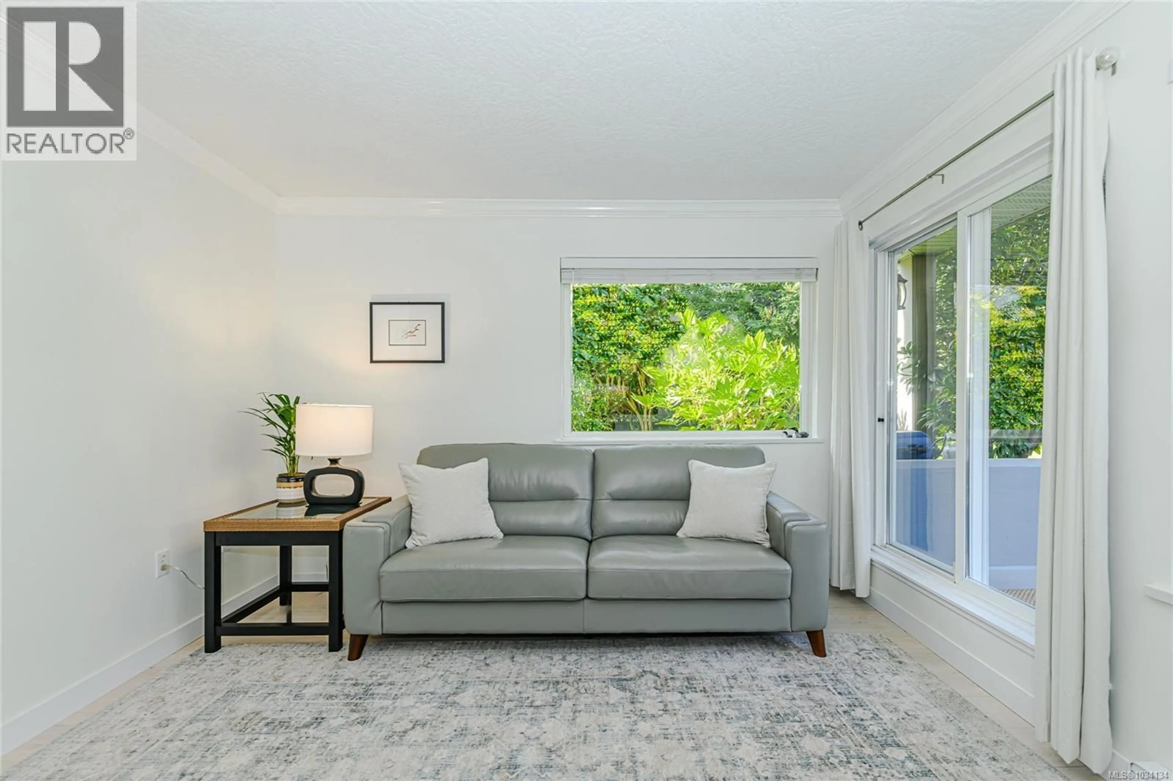 Living room with furniture, unknown for 103 - 3180 ALBINA STREET, Saanich British Columbia V9A1Z5