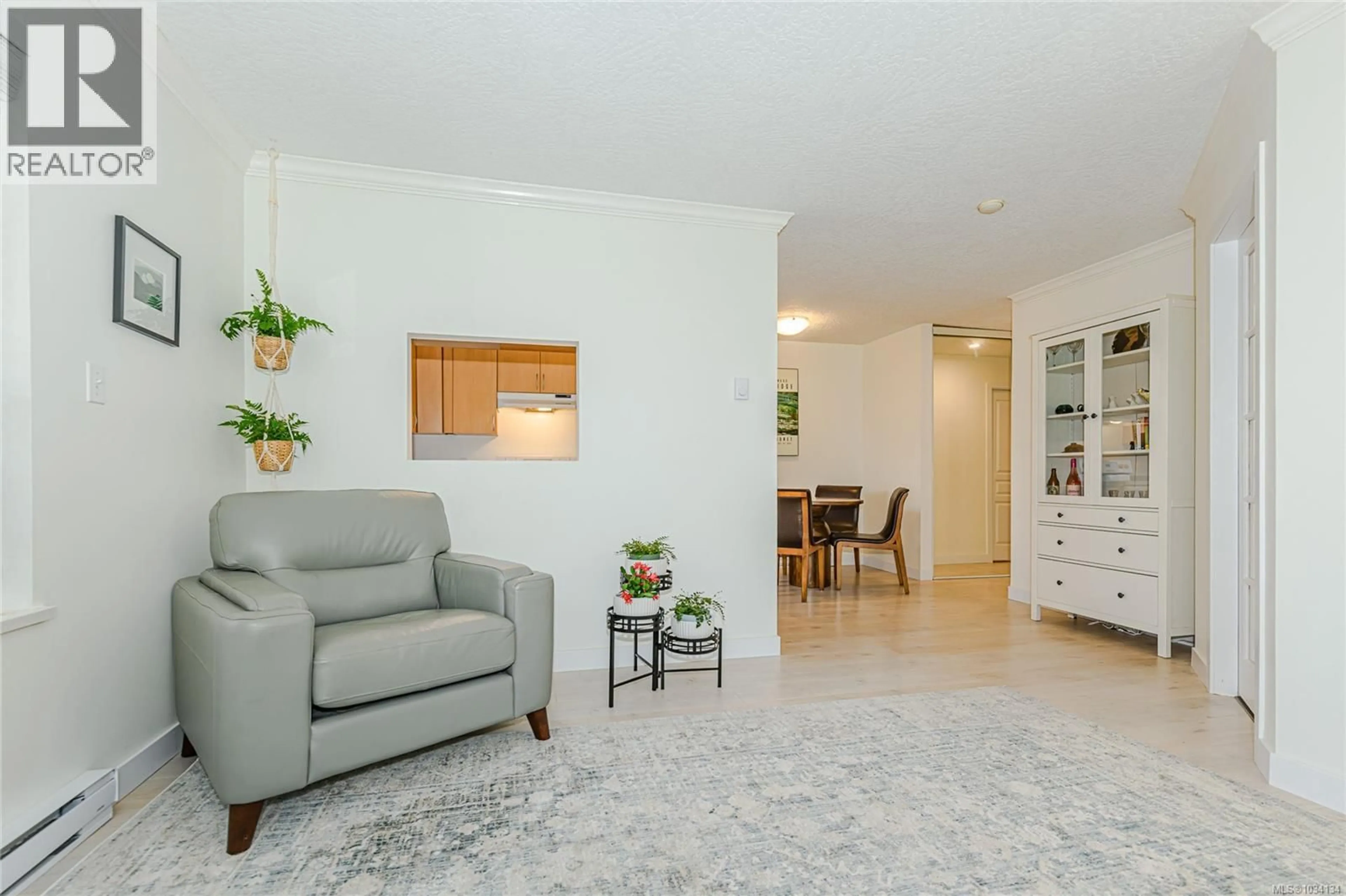 Living room with furniture, unknown for 103 - 3180 ALBINA STREET, Saanich British Columbia V9A1Z5