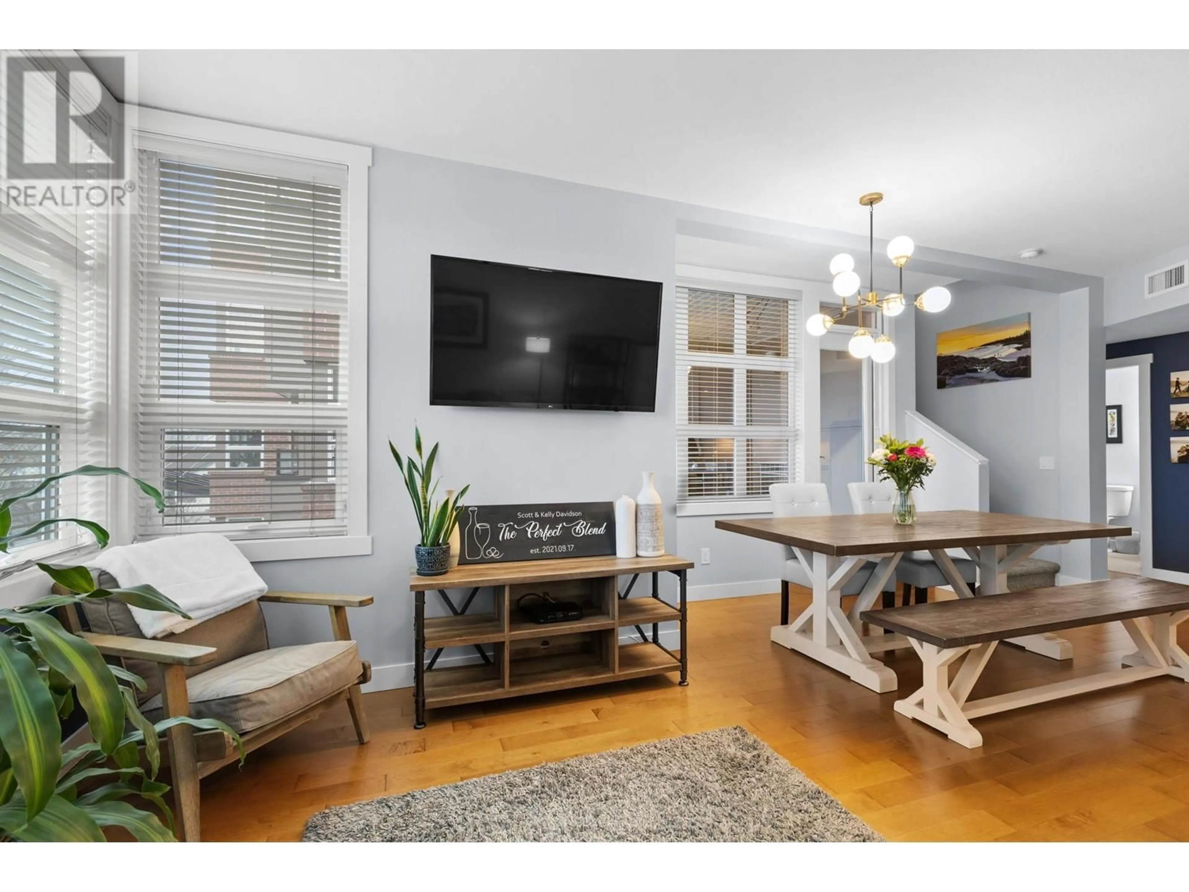 Living room with furniture, wood/laminate floor for 214 - 700 MARTIN AVENUE, Kelowna British Columbia V1Y6V4
