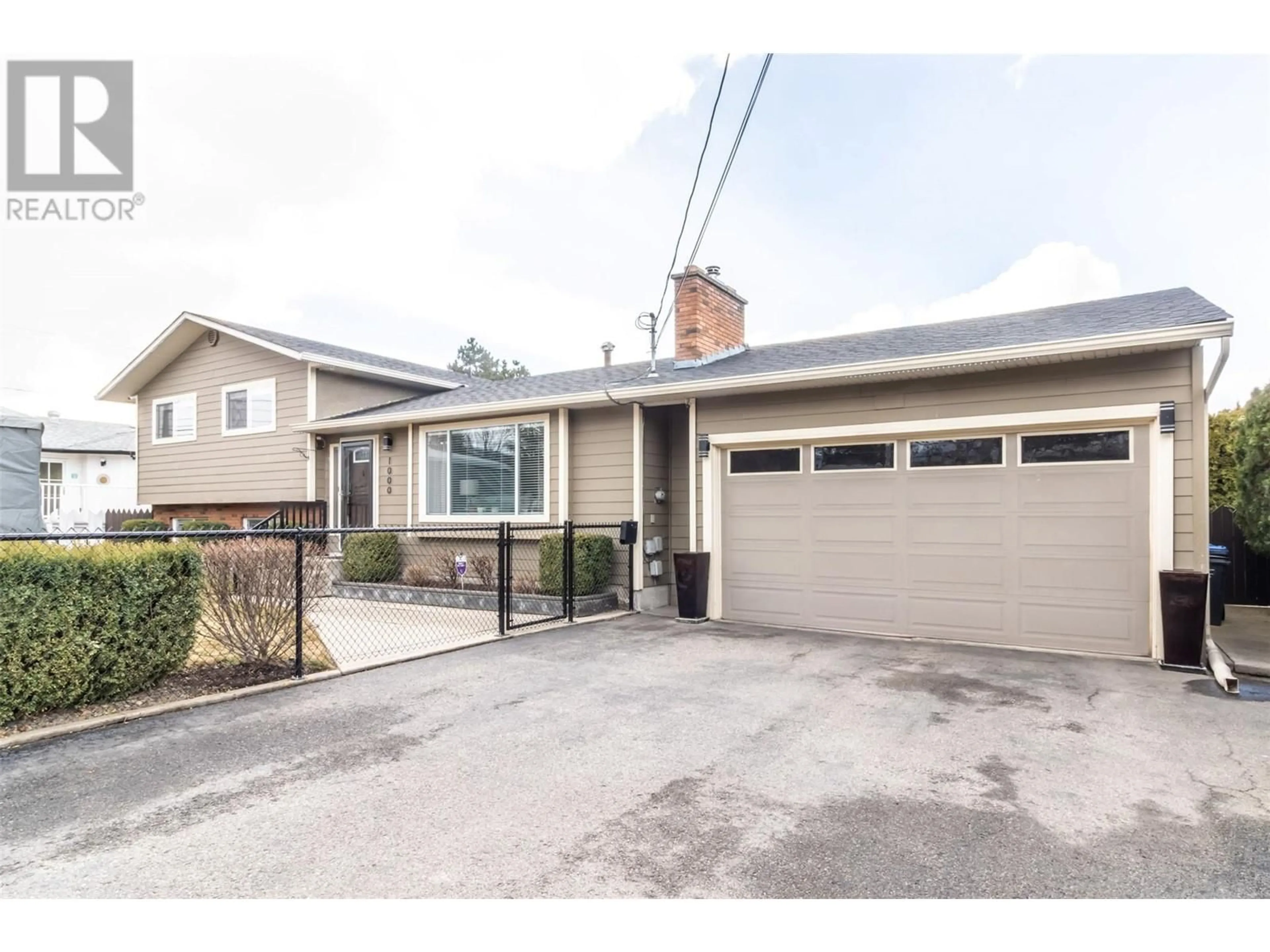 Home with vinyl exterior material, street for 1000 EUCLID ROAD, Kelowna British Columbia V1X3K9