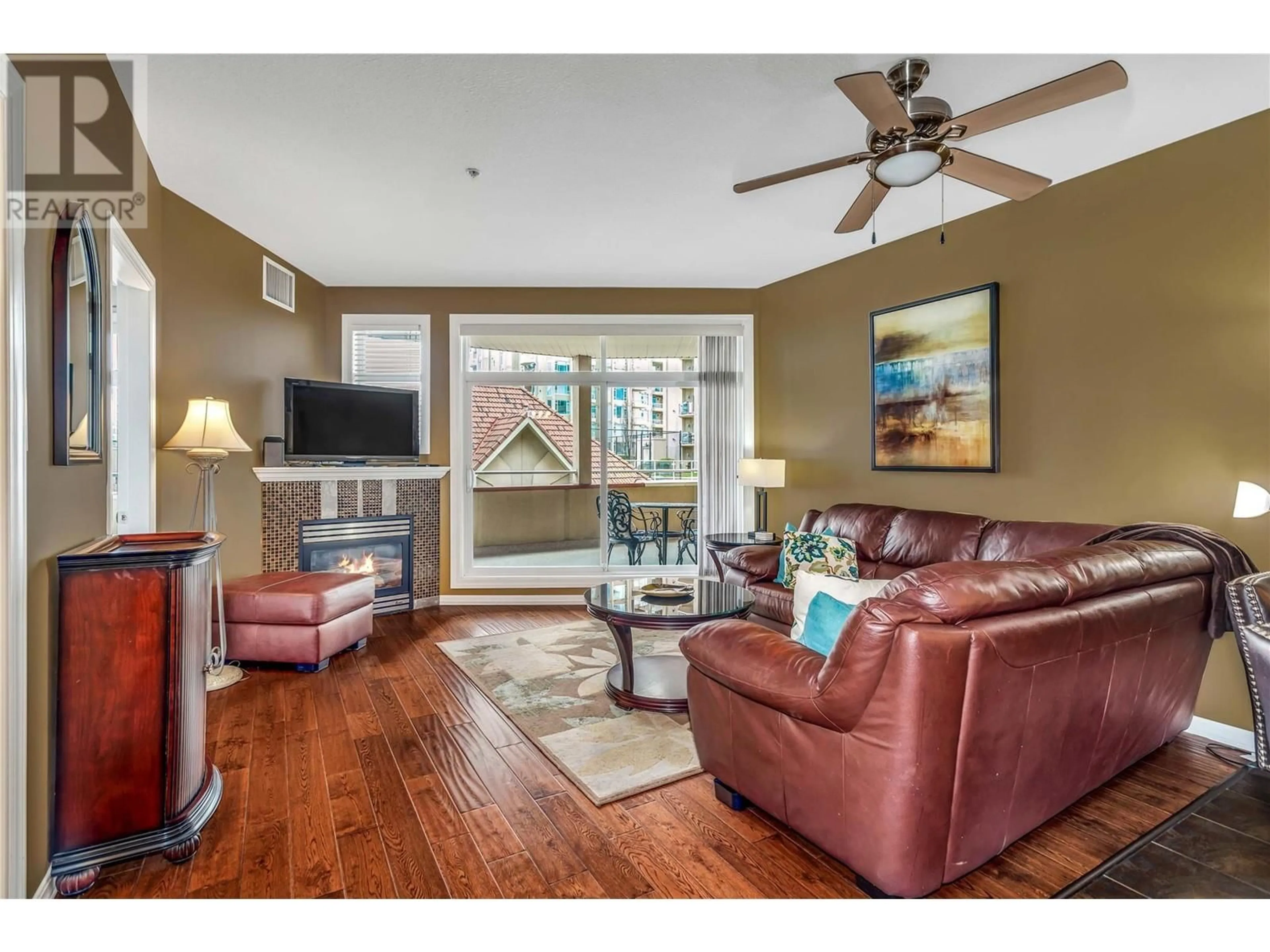 Living room with furniture, wood/laminate floor for 342 - 1088 SUNSET DRIVE, Kelowna British Columbia V1Y9W1