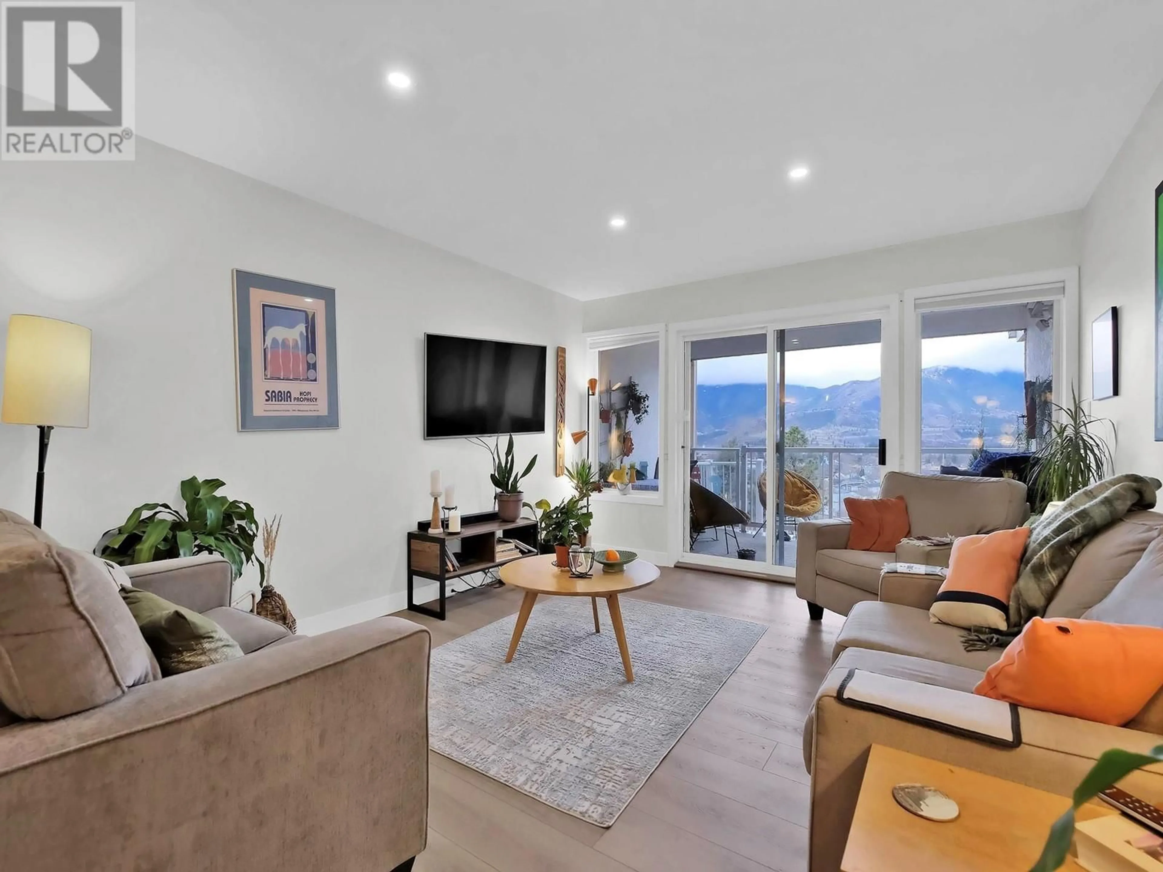 Living room with furniture, wood/laminate floor for 106 - 391 FARRELL STREET, Penticton British Columbia V2A4G3