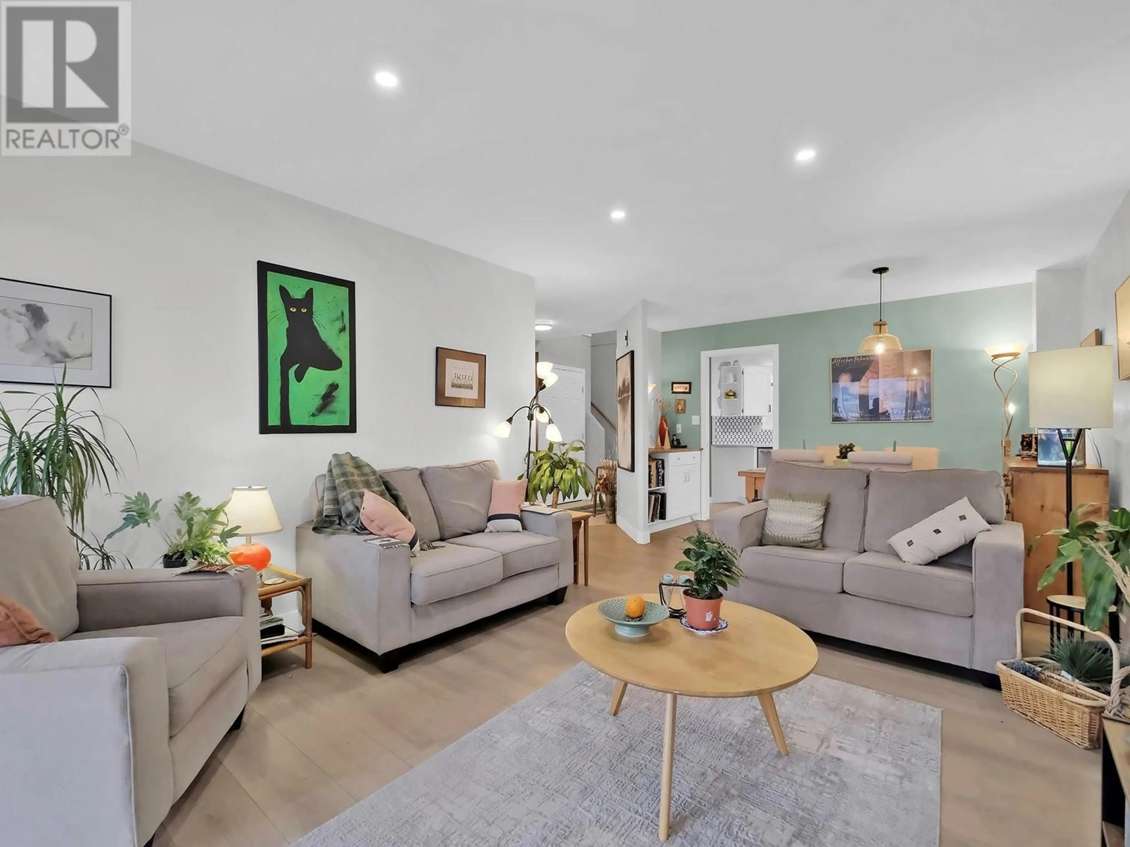 Living room with furniture, wood/laminate floor for 106 - 391 FARRELL STREET, Penticton British Columbia V2A4G3