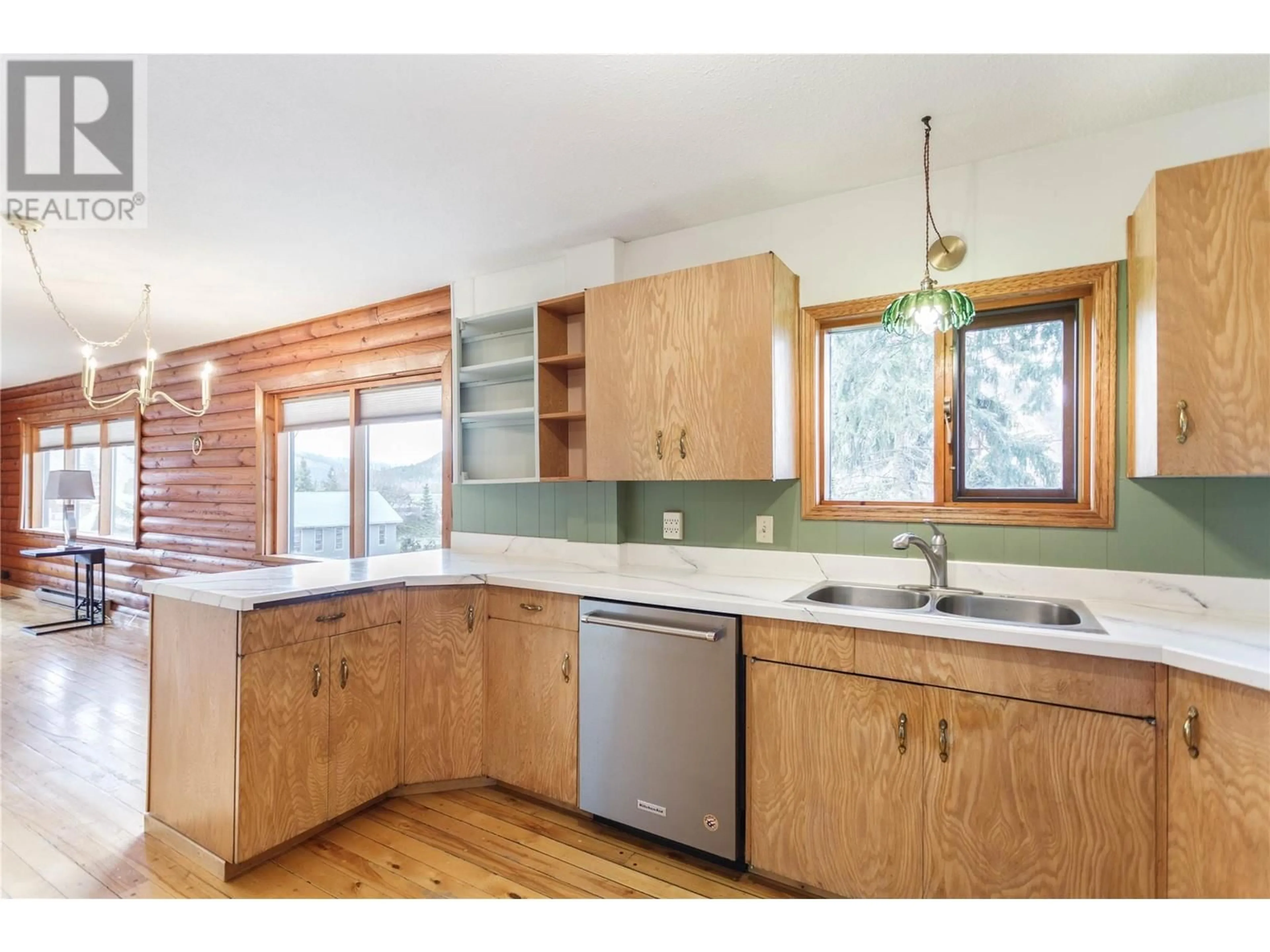 Open concept kitchen, wood/laminate floor for 2550 SHUSWAP AVENUE, Lumby British Columbia V0E2G0