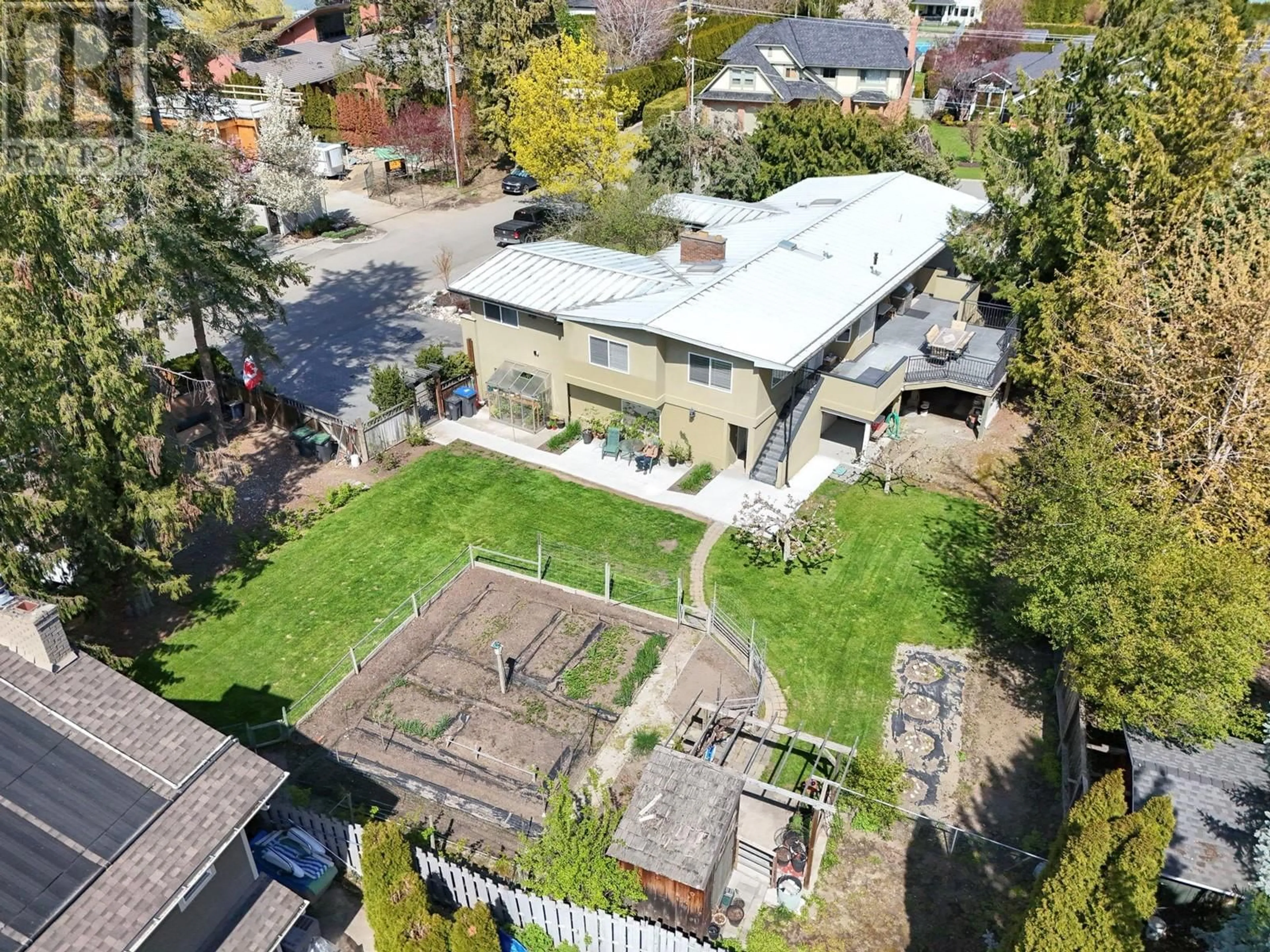 A pic from outside/outdoor area/front of a property/back of a property/a pic from drone, street for 4467 LAKELAND ROAD, Kelowna British Columbia V1W1E1
