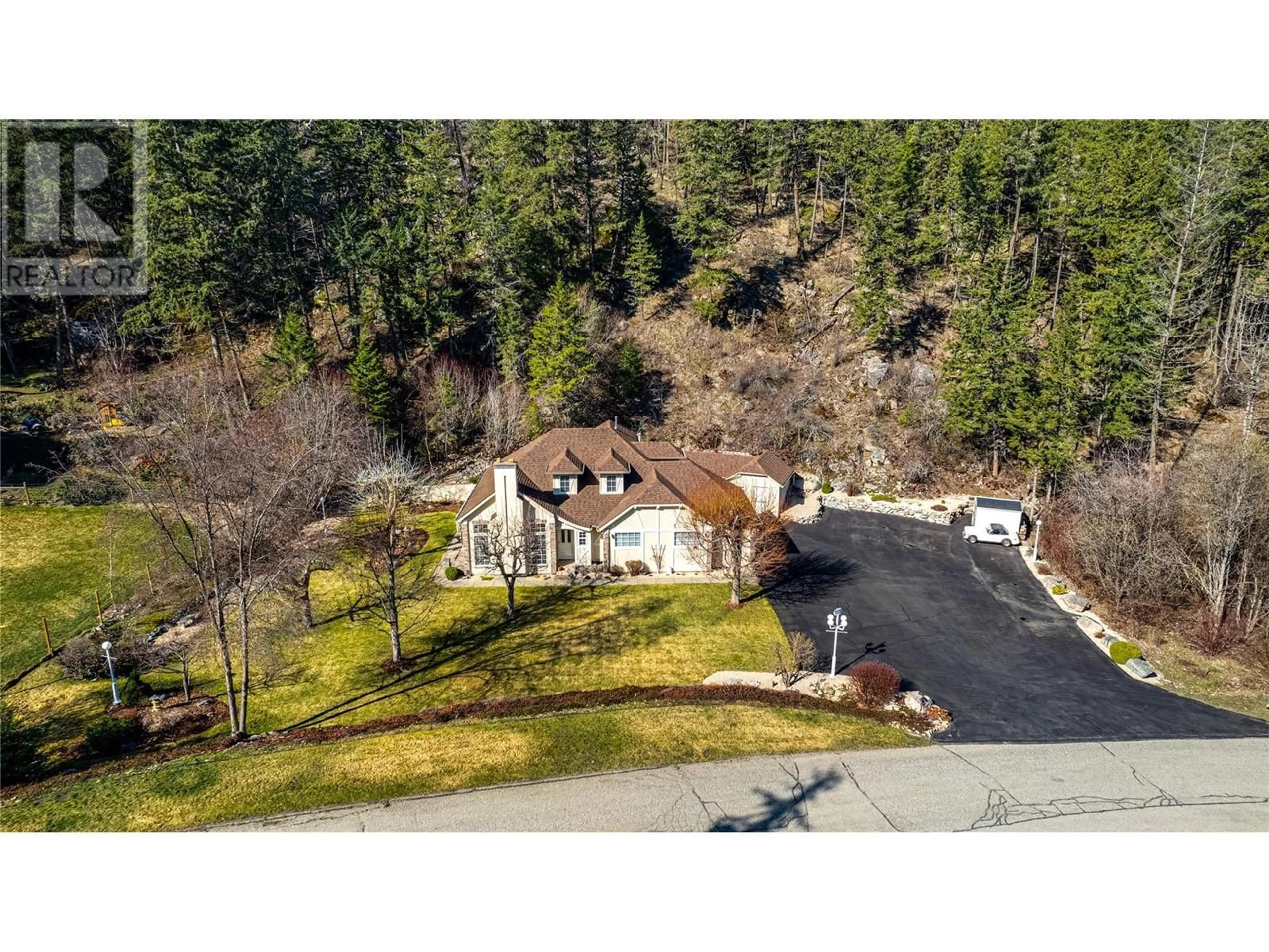 A pic from outside/outdoor area/front of a property/back of a property/a pic from drone, mountain view for 9292 CHINOOK ROAD, Vernon British Columbia V1H1K3