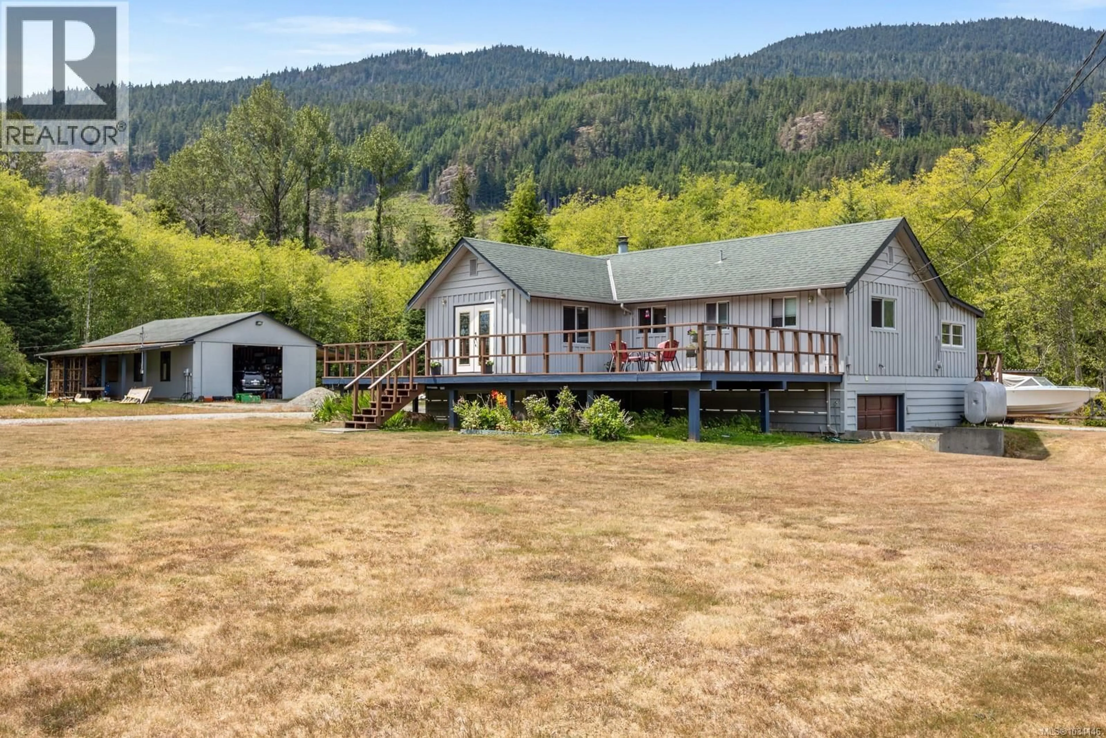 A pic from outside/outdoor area/front of a property/back of a property/a pic from drone, mountain view for 843 SAYWARD ROAD, Sayward British Columbia V0P1R0