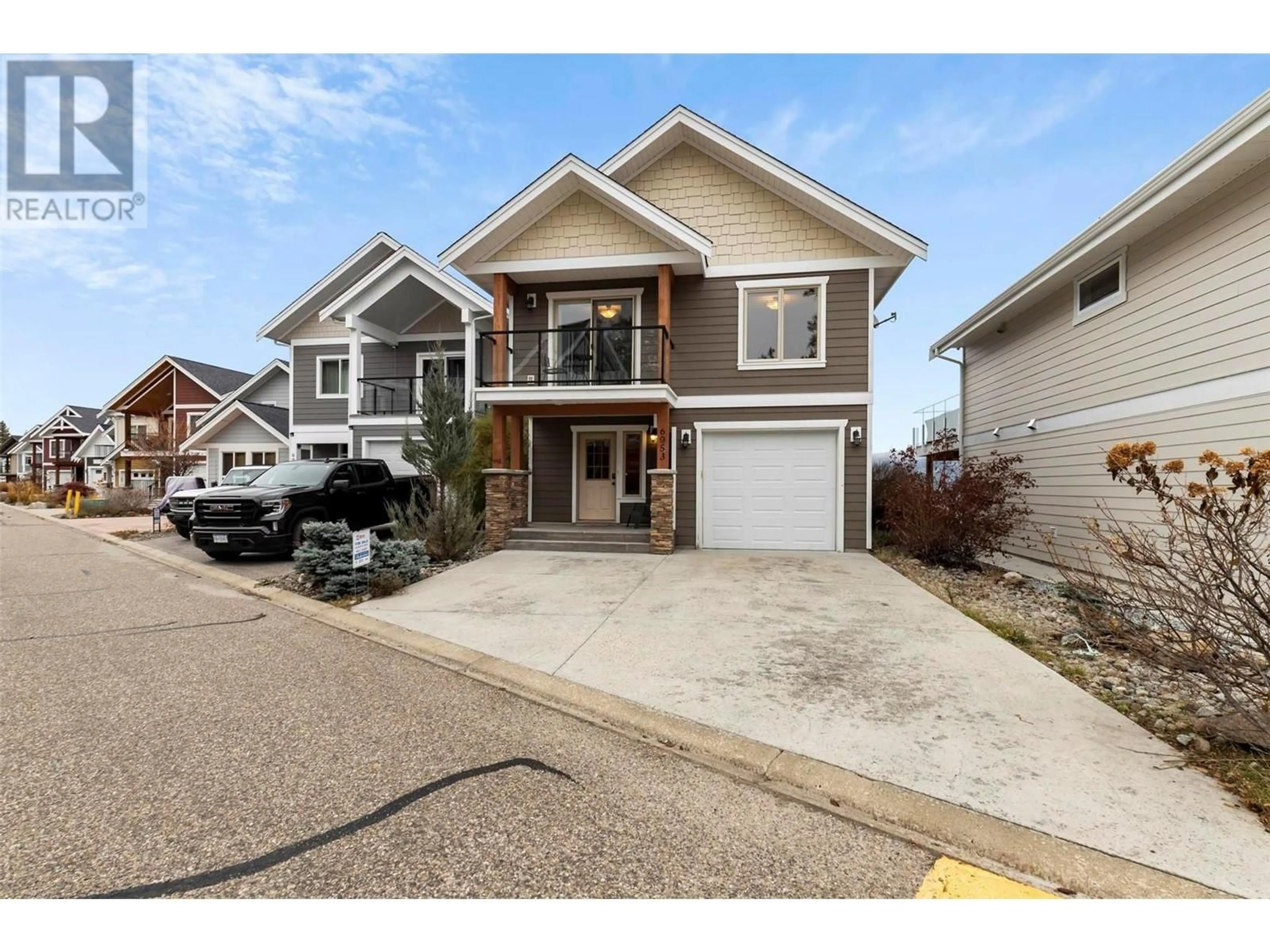 Home with vinyl exterior material, street for 6953 TERAZONA DRIVE, Kelowna British Columbia V1Z3R8