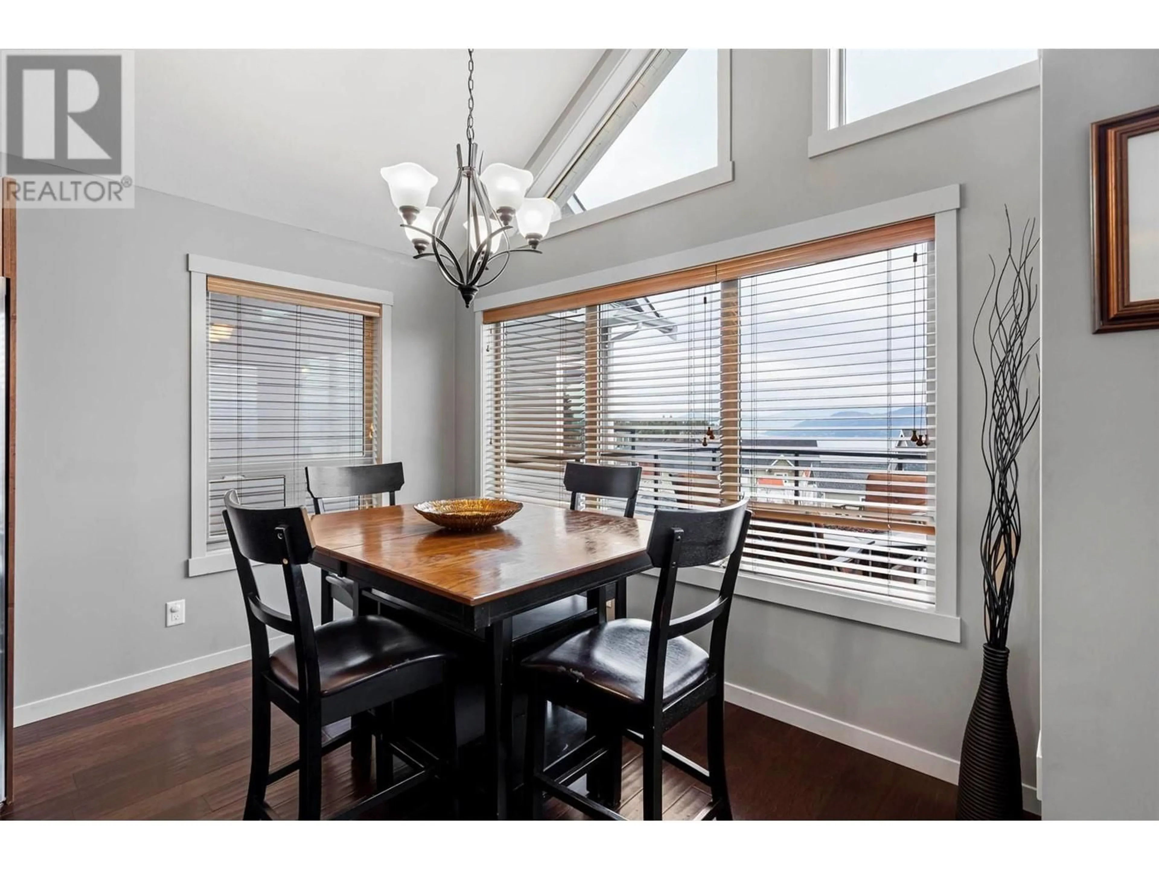 Dining room, wood/laminate floor for 6953 TERAZONA DRIVE, Kelowna British Columbia V1Z3R8