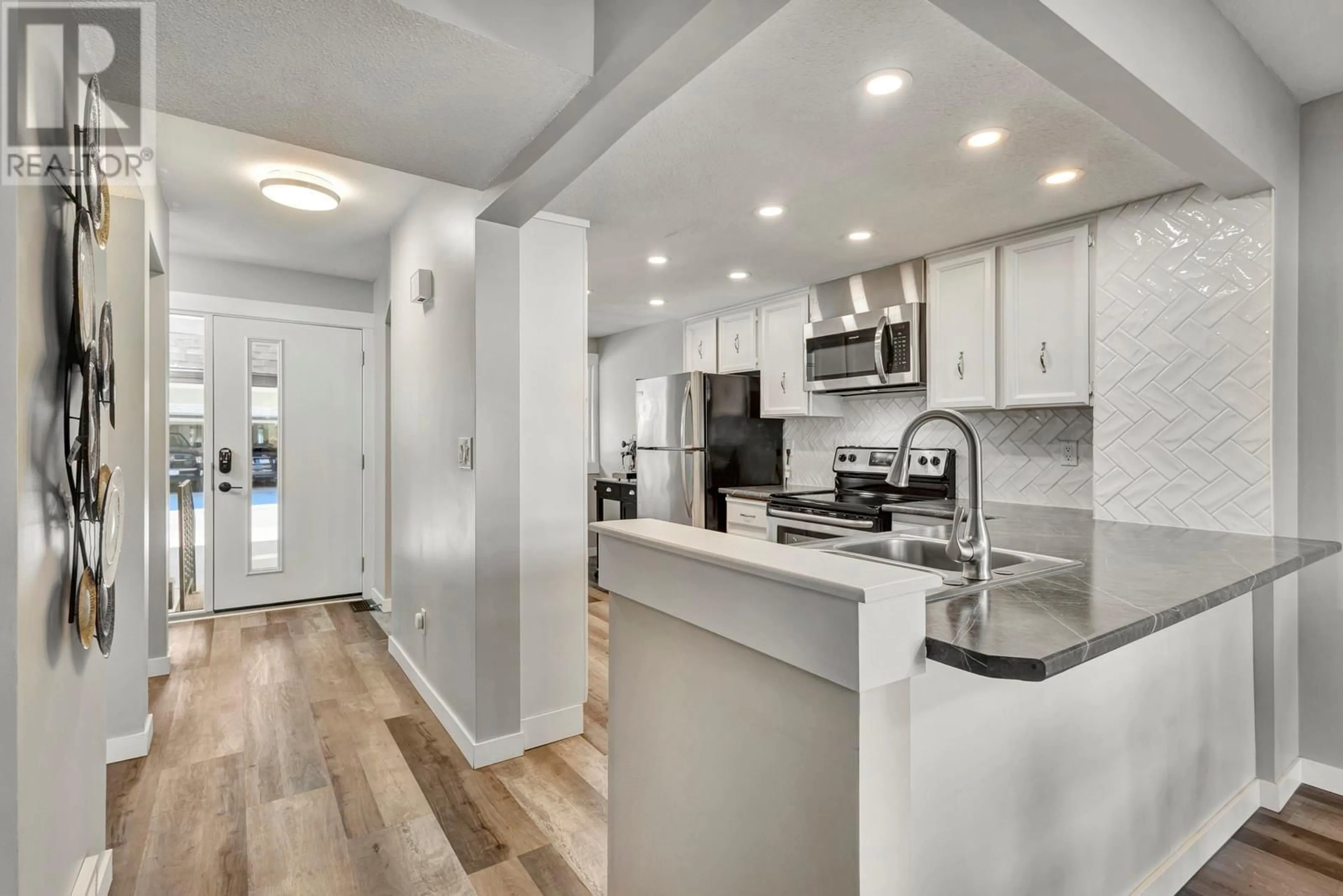 Open concept kitchen, ceramic/tile floor for 109 - 2125 BURTCH ROAD, Kelowna British Columbia V1Y8N1