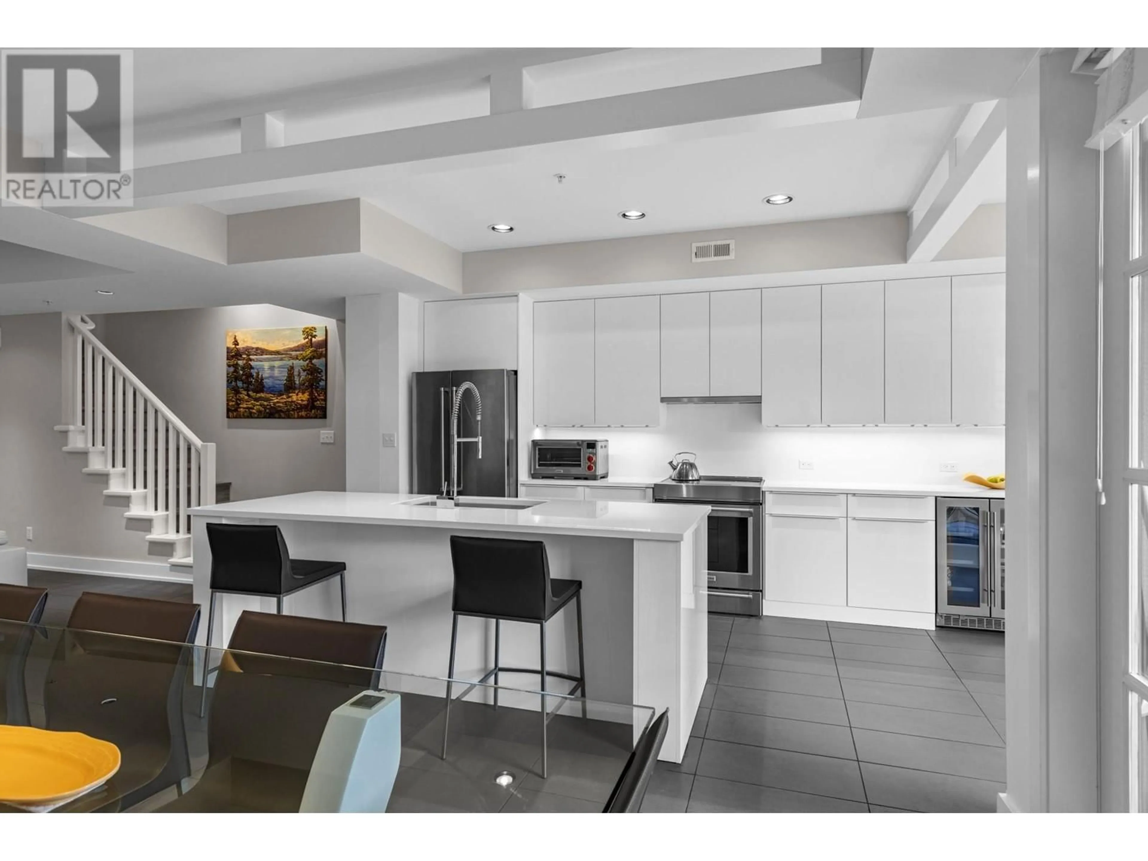 Open concept kitchen, ceramic/tile floor for 523 - 3880 TRUSWELL ROAD, Kelowna British Columbia V1W5A2