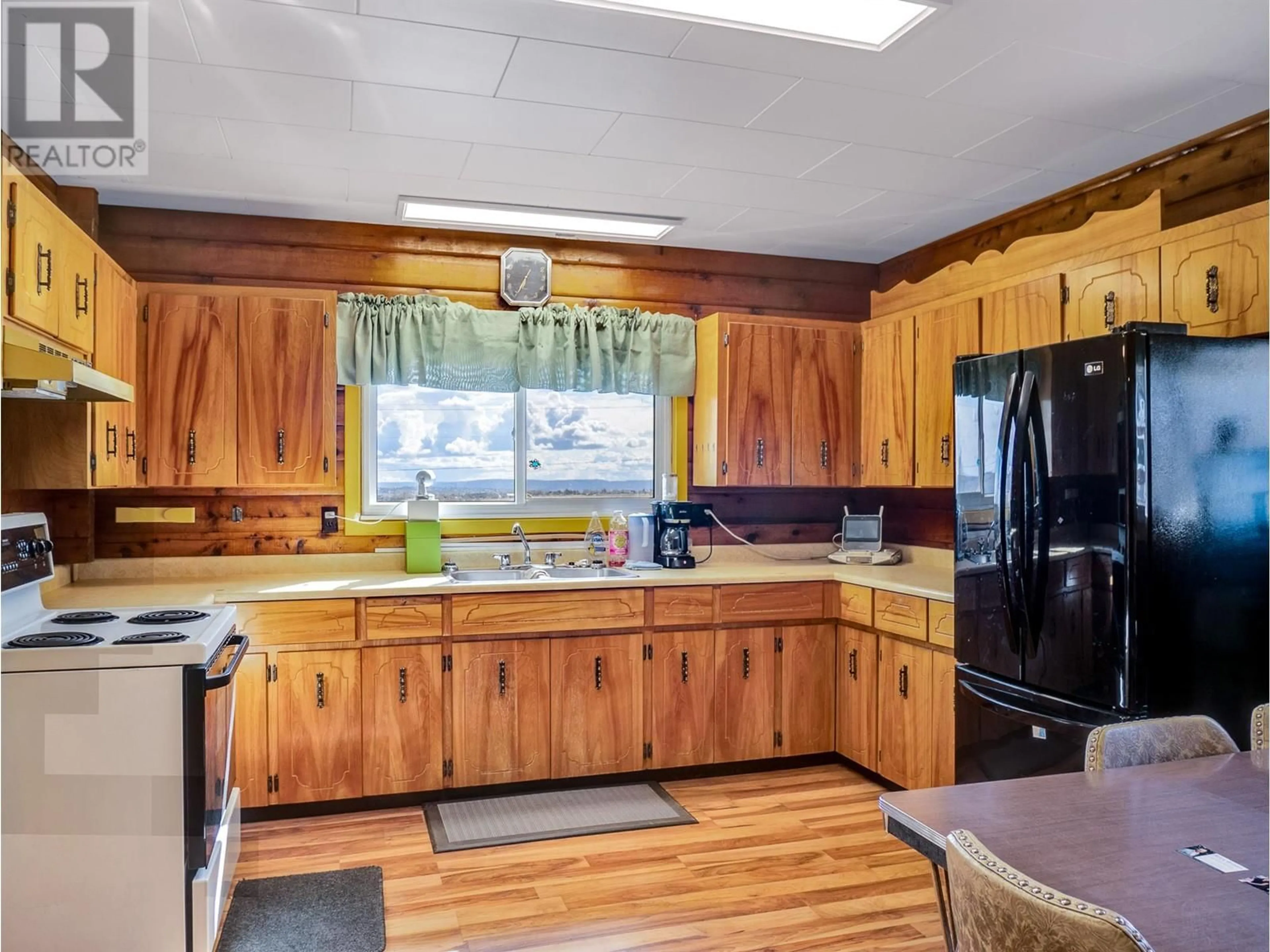 Standard kitchen, wood/laminate floor for 8909 227 ROAD, Dawson Creek British Columbia V1G3T6