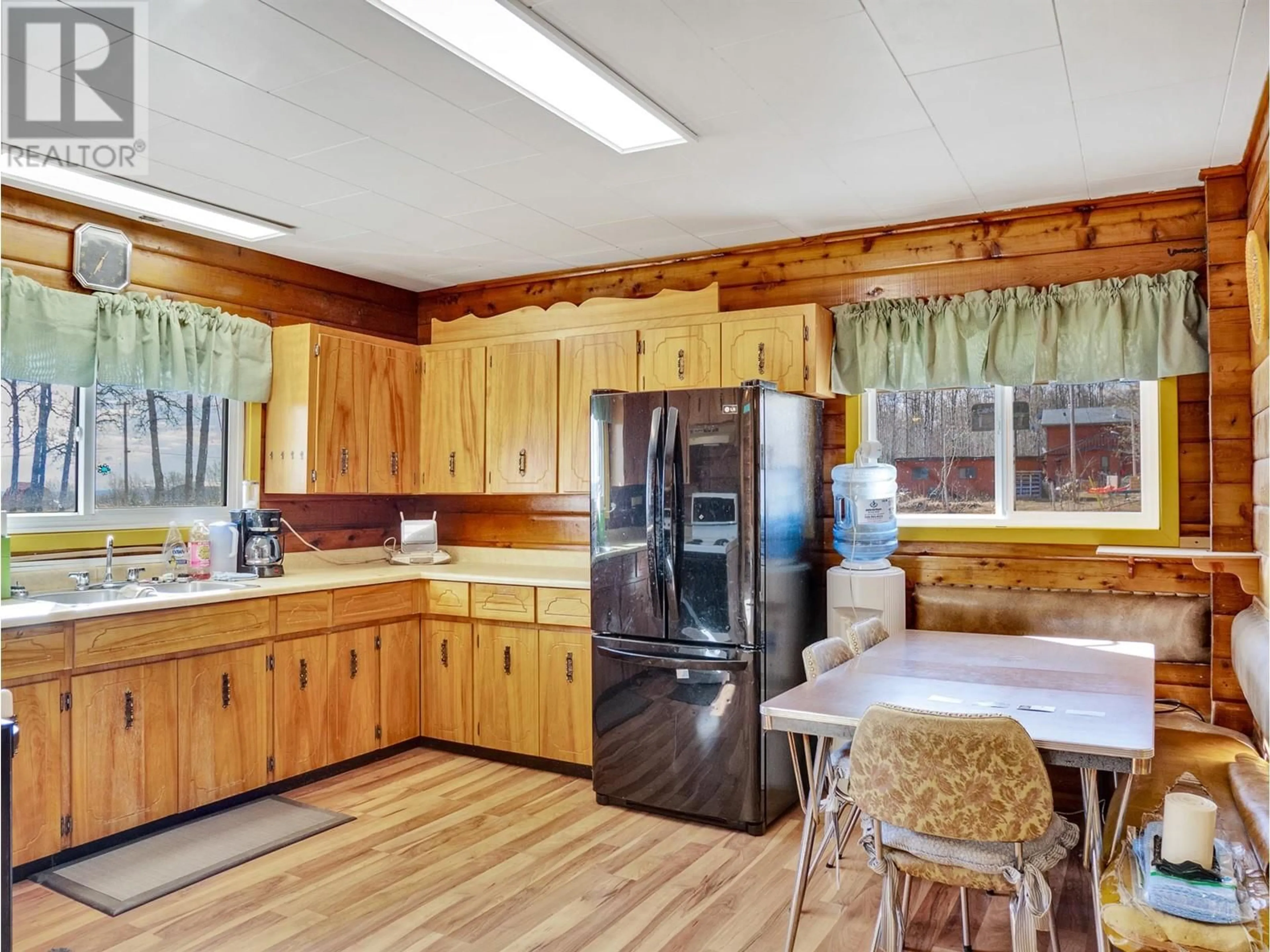 Open concept kitchen, wood/laminate floor for 8909 227 ROAD, Dawson Creek British Columbia V1G3T6