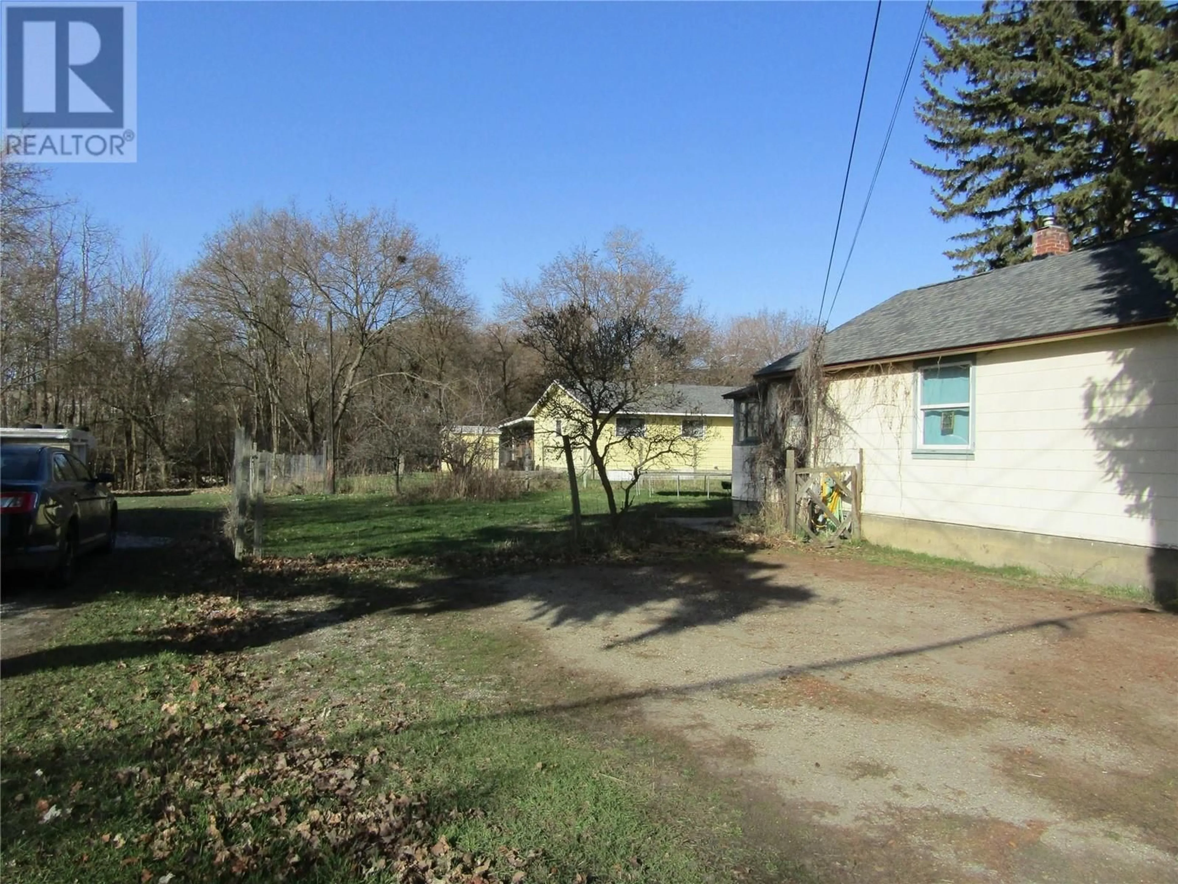 A pic from outside/outdoor area/front of a property/back of a property/a pic from drone, street for 7485 7TH STREET, Grand Forks British Columbia V0H1H0