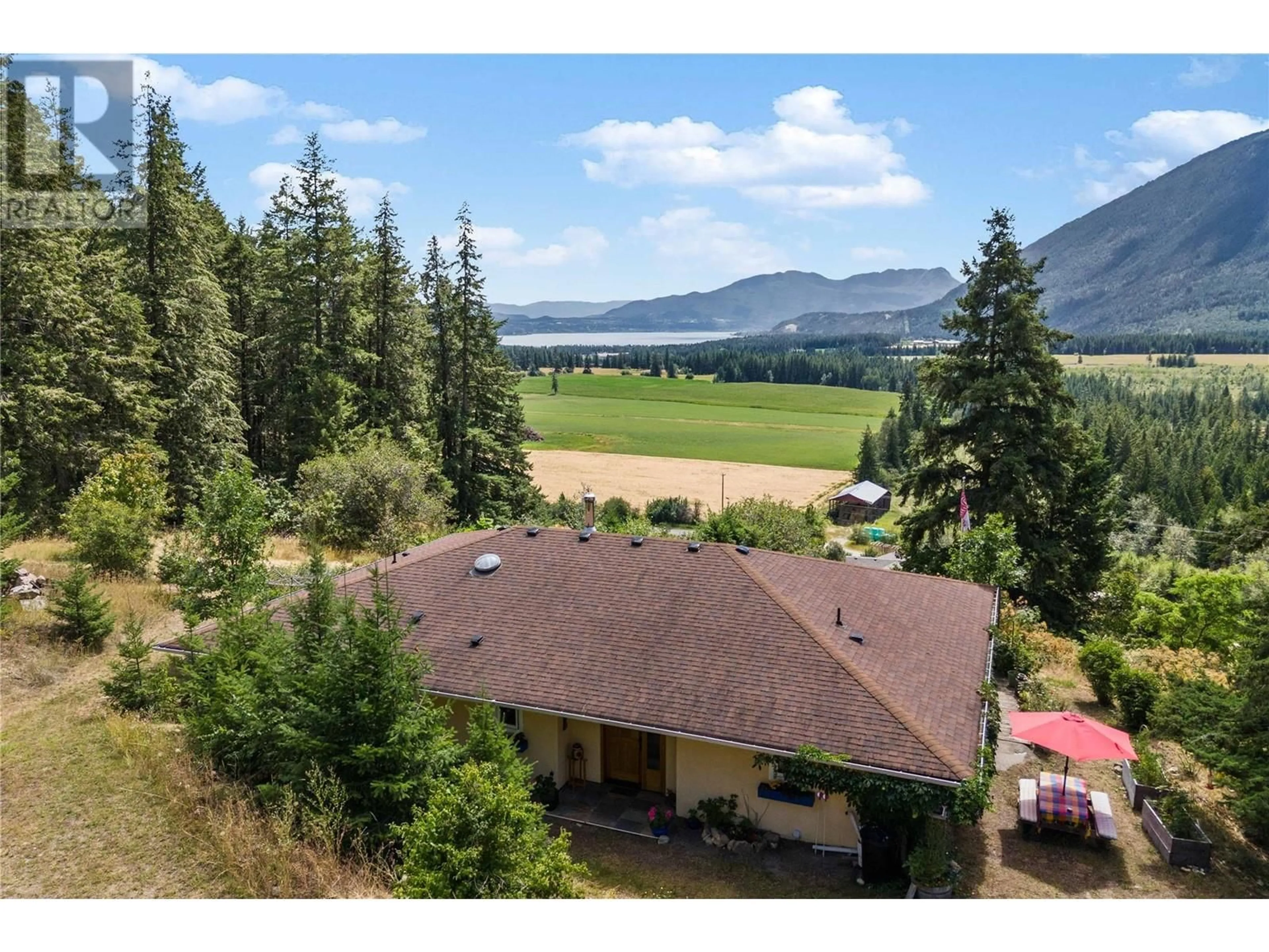 A pic from outside/outdoor area/front of a property/back of a property/a pic from drone, mountain view for 1527 TAPPEN VALLEY ROAD, Tappen British Columbia V0E2X0