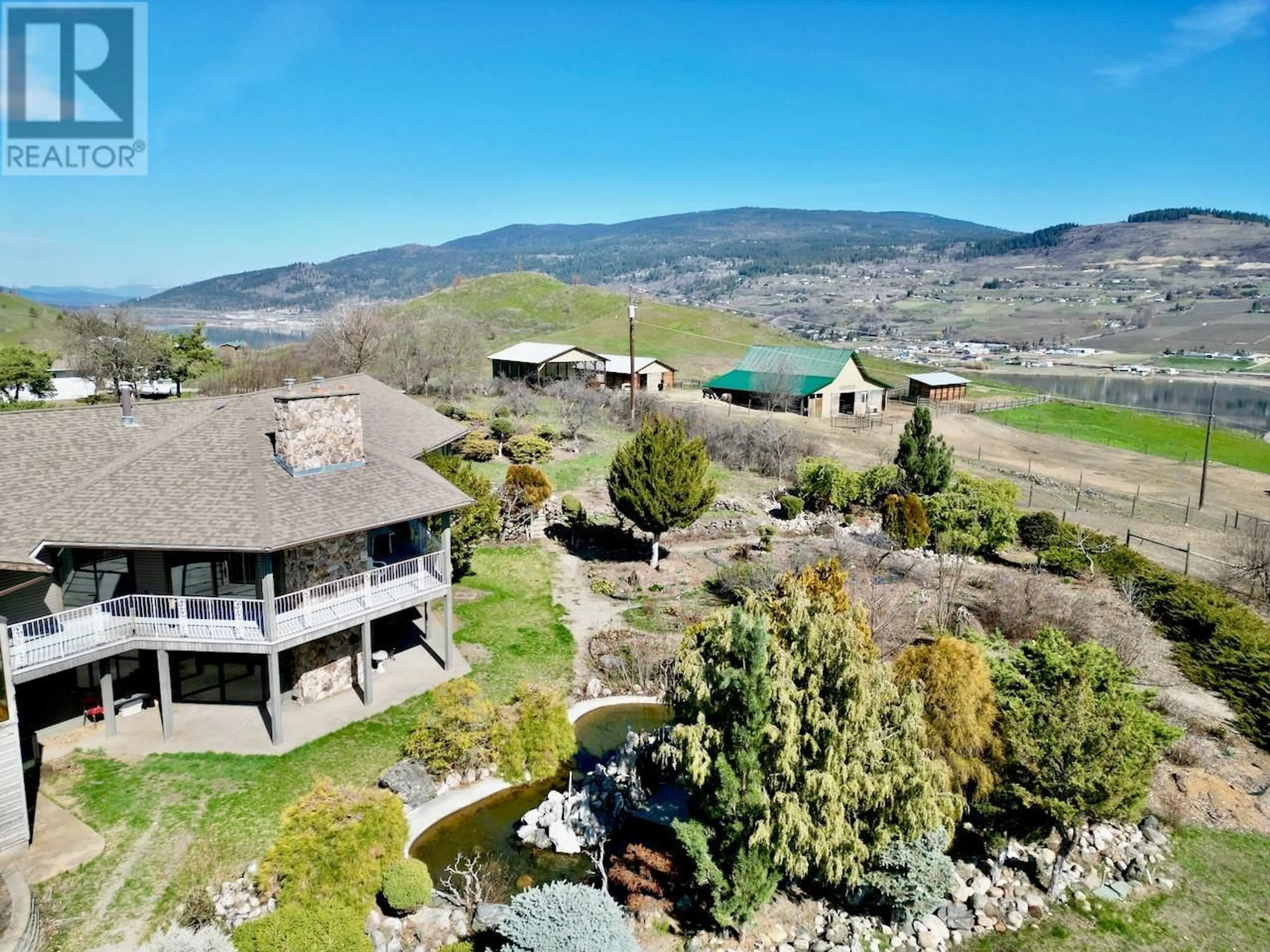 A pic from outside/outdoor area/front of a property/back of a property/a pic from drone, mountain view for 6841 RAVEN ROAD, Vernon British Columbia V1H1P9