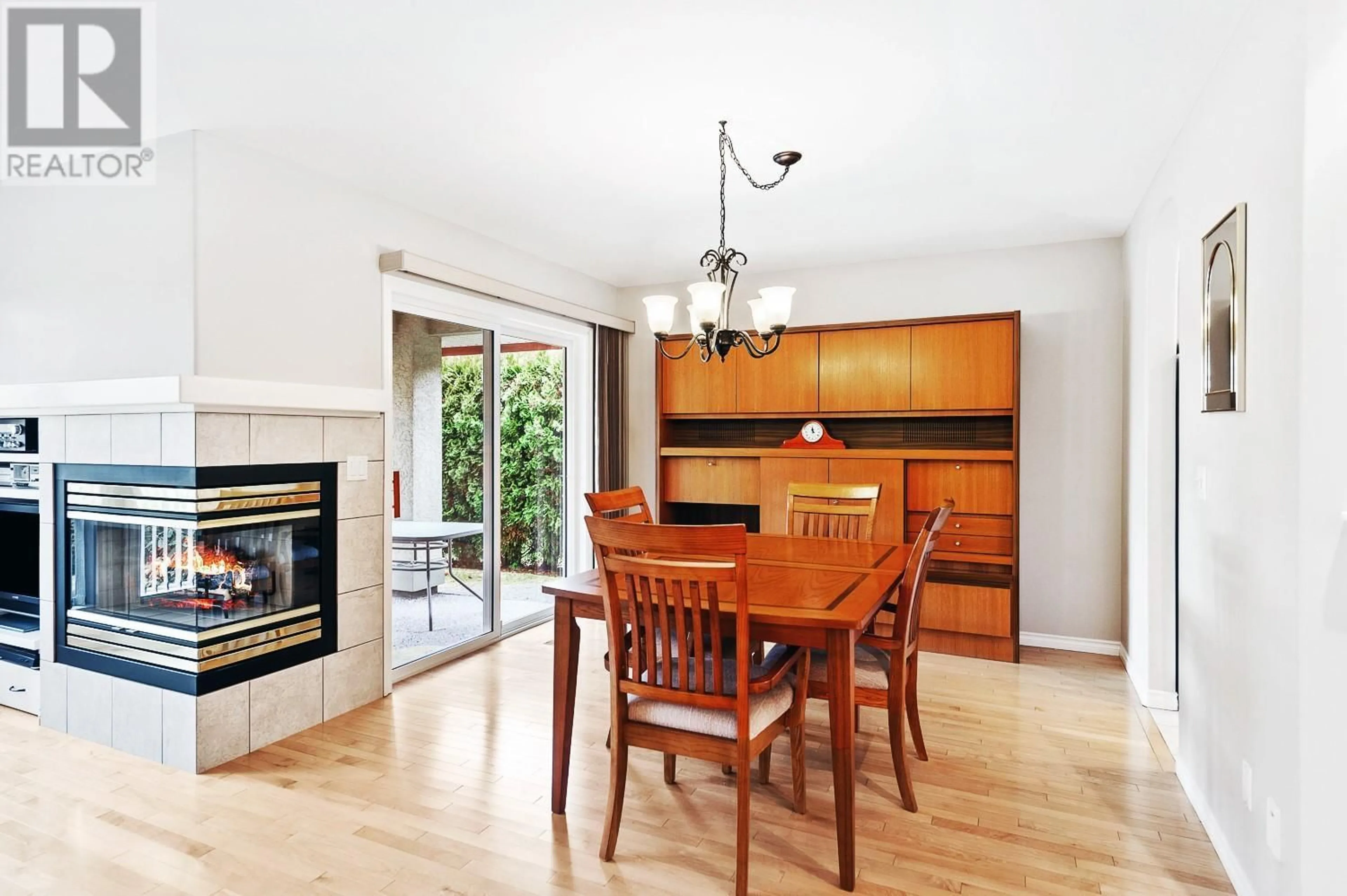 Dining room, wood/laminate floor for 3964 GALLAGHERS PARKWAY, Kelowna British Columbia V1W3Z8