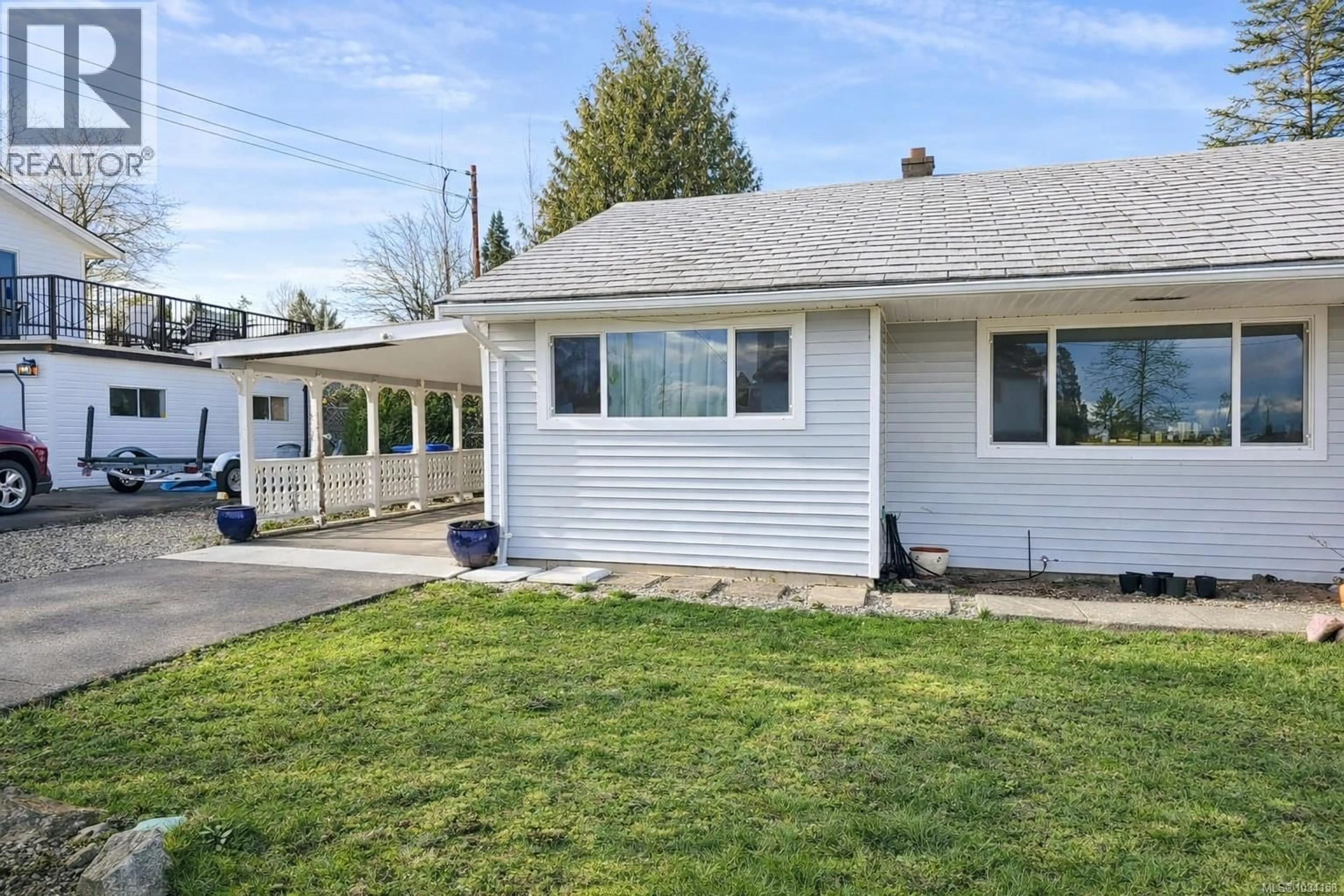 Home with vinyl exterior material, street for 2114 MCKENZIE AVENUE, Comox British Columbia V9M1M7