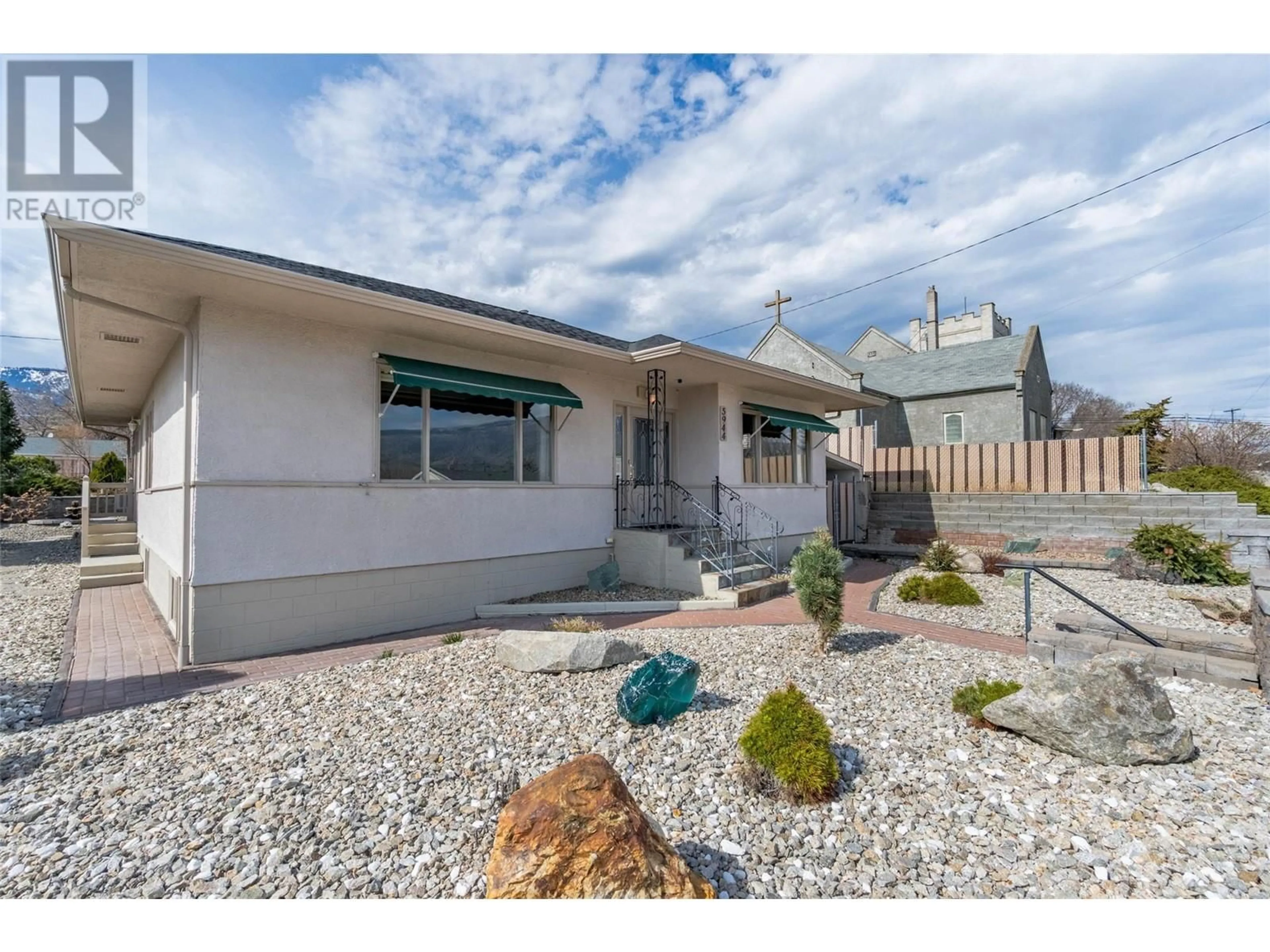 Home with vinyl exterior material, street for 5944 NICOLA STREET, Oliver British Columbia V0H1T0