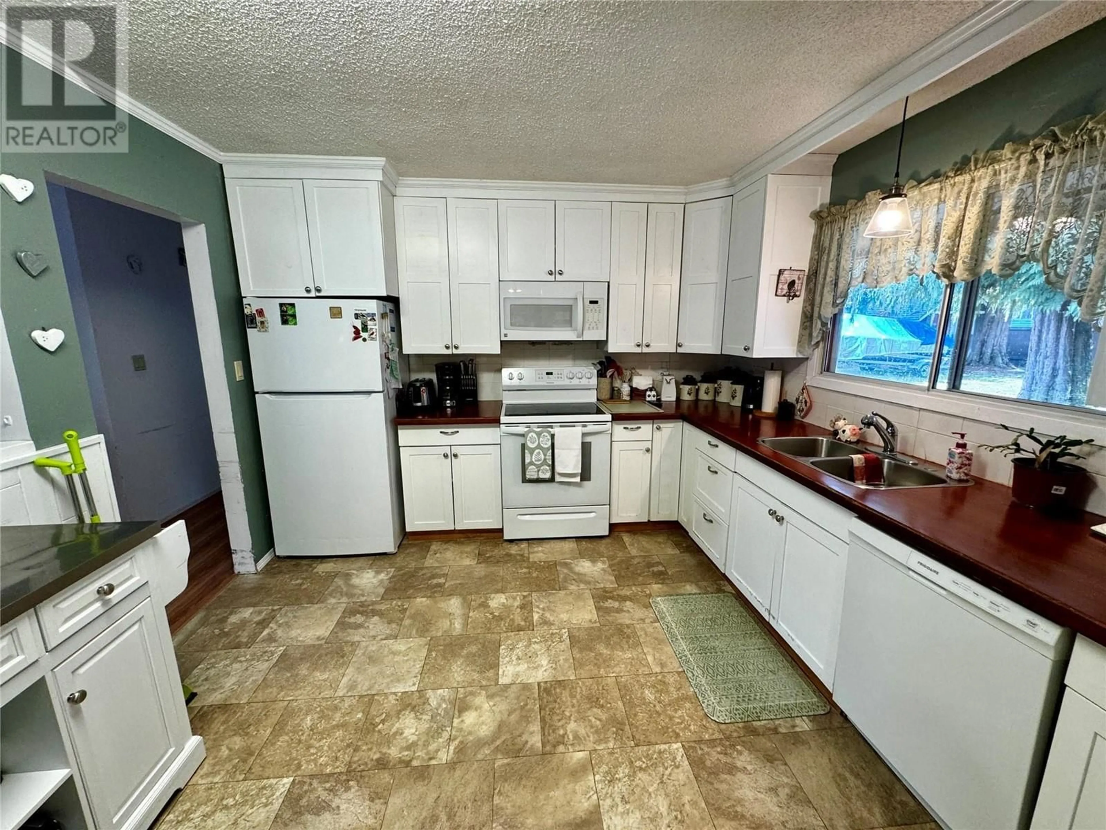 Standard kitchen, ceramic/tile floor for 709 SPRUCE STREET, Sicamous British Columbia V0E2V0
