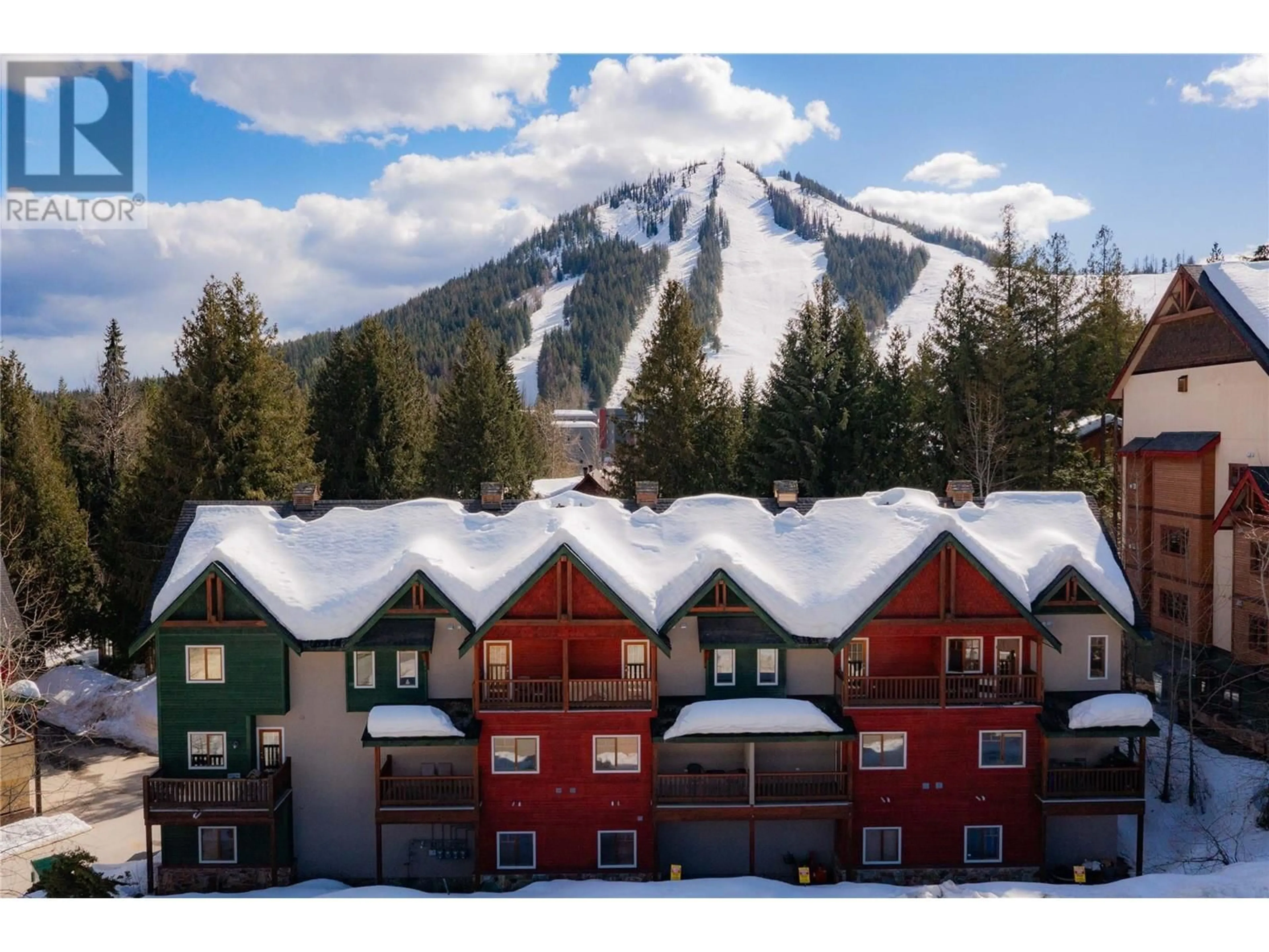 A pic from outside/outdoor area/front of a property/back of a property/a pic from drone, mountain view for B - 1003 MOUNTAIN VIEW ROAD, Rossland British Columbia V0G1Y0