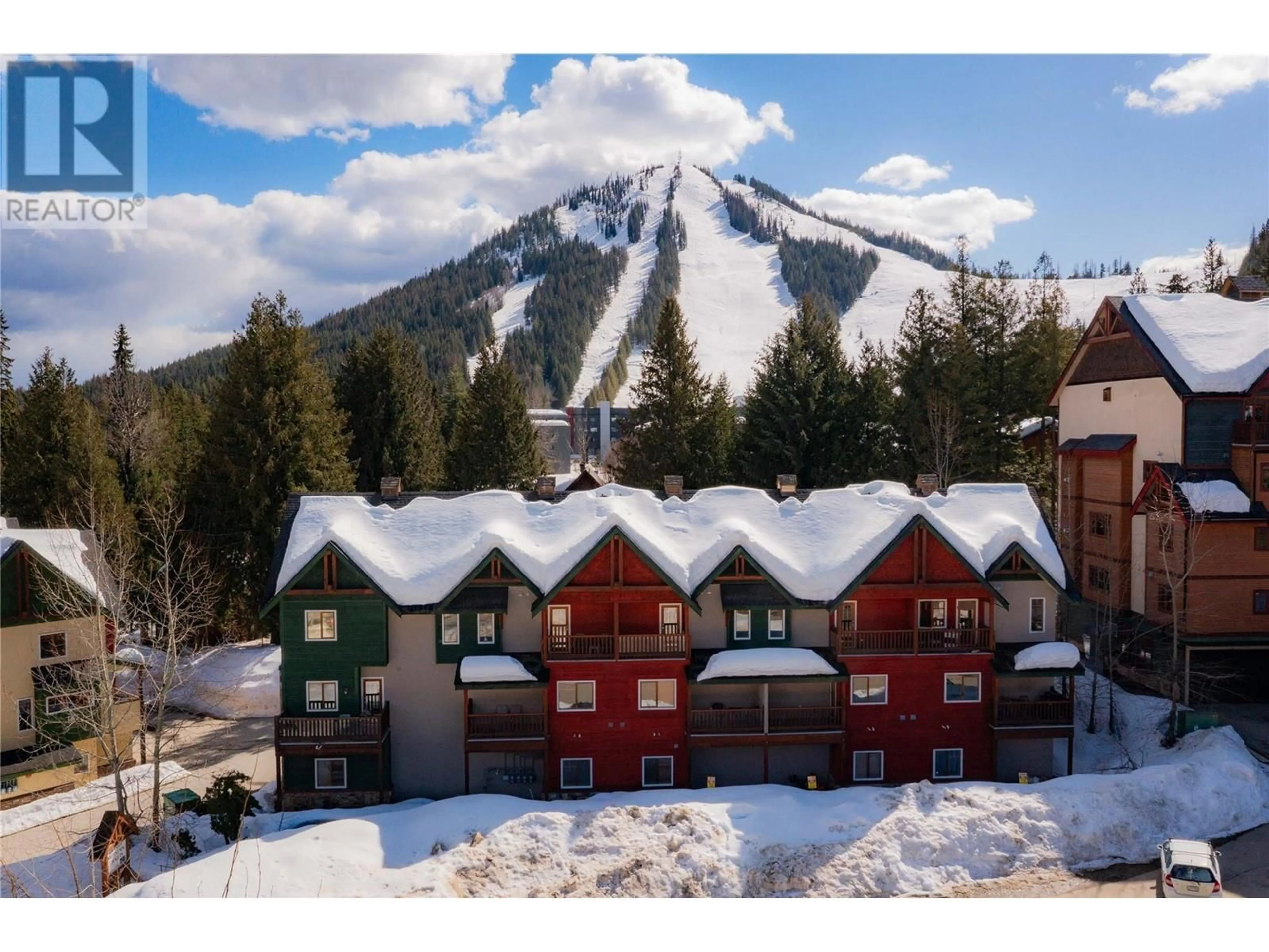 A pic from outside/outdoor area/front of a property/back of a property/a pic from drone, mountain view for B - 1003 MOUNTAIN VIEW ROAD, Rossland British Columbia V0G1Y0