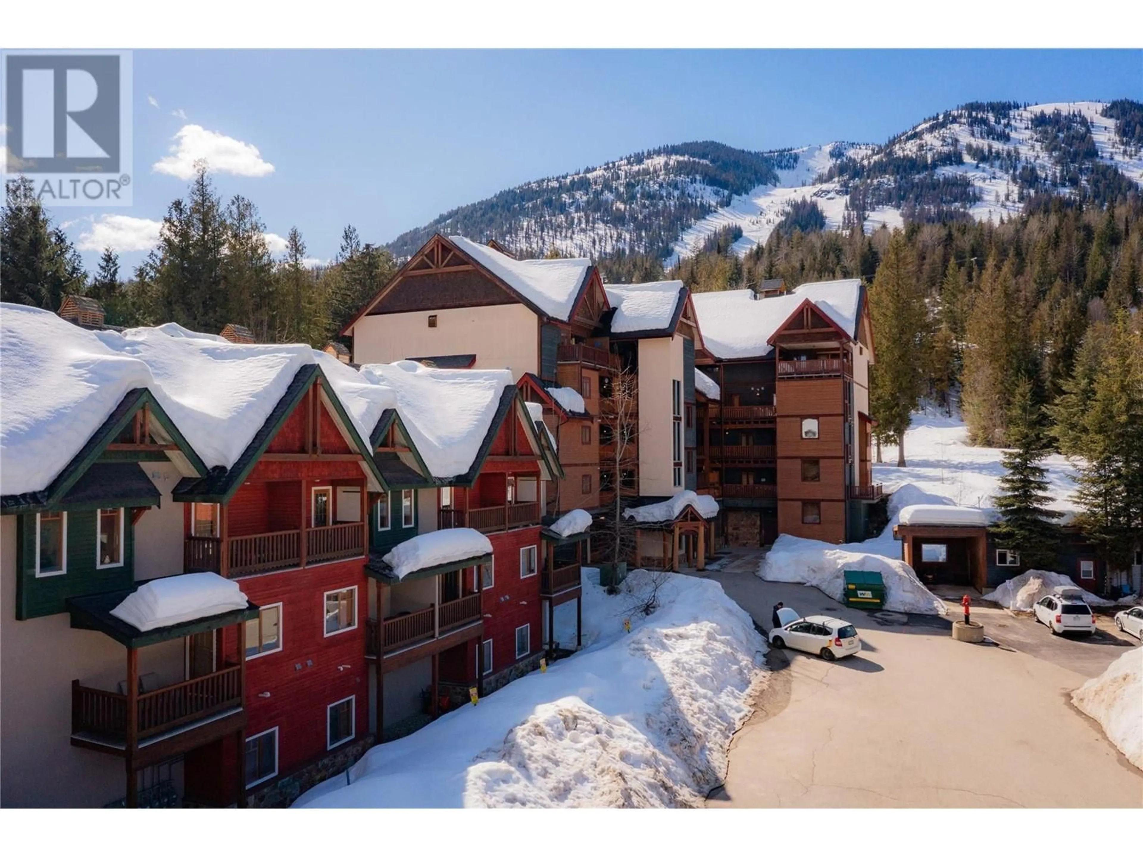 A pic from outside/outdoor area/front of a property/back of a property/a pic from drone, mountain view for B - 1003 MOUNTAIN VIEW ROAD, Rossland British Columbia V0G1Y0