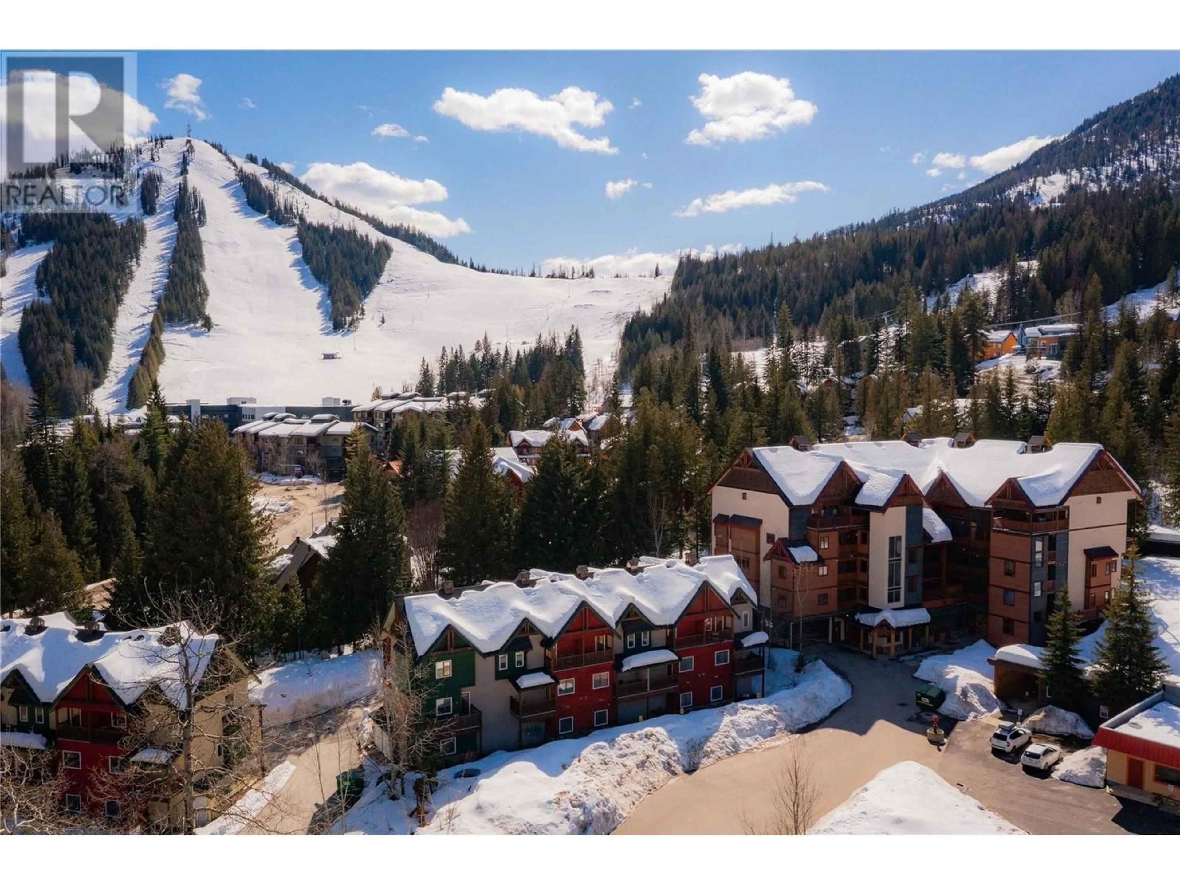 A pic from outside/outdoor area/front of a property/back of a property/a pic from drone, mountain view for B - 1003 MOUNTAIN VIEW ROAD, Rossland British Columbia V0G1Y0