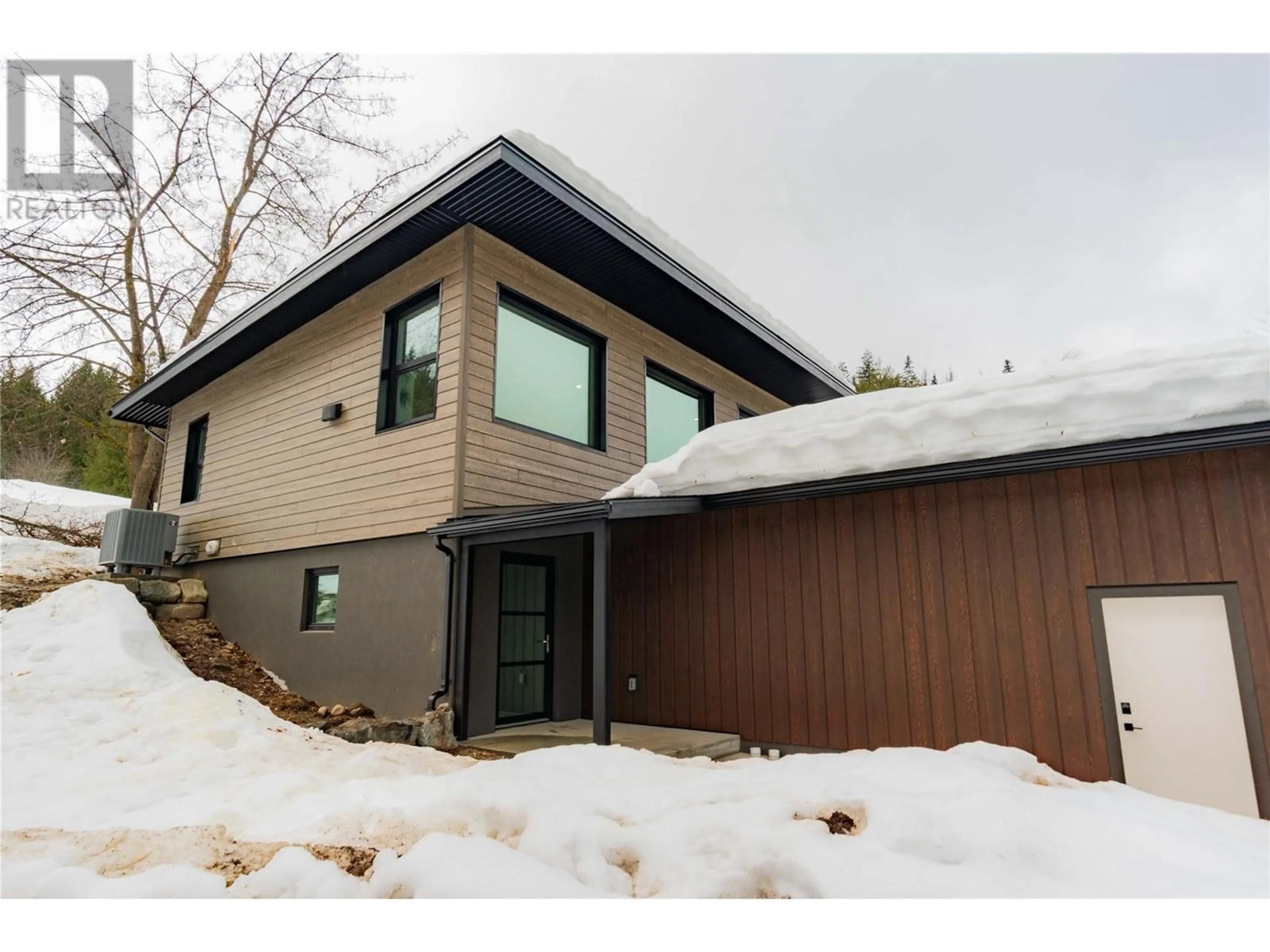 Home with vinyl exterior material, street for 1139 BLACK BEAR DRIVE, Rossland British Columbia V0G1Y0
