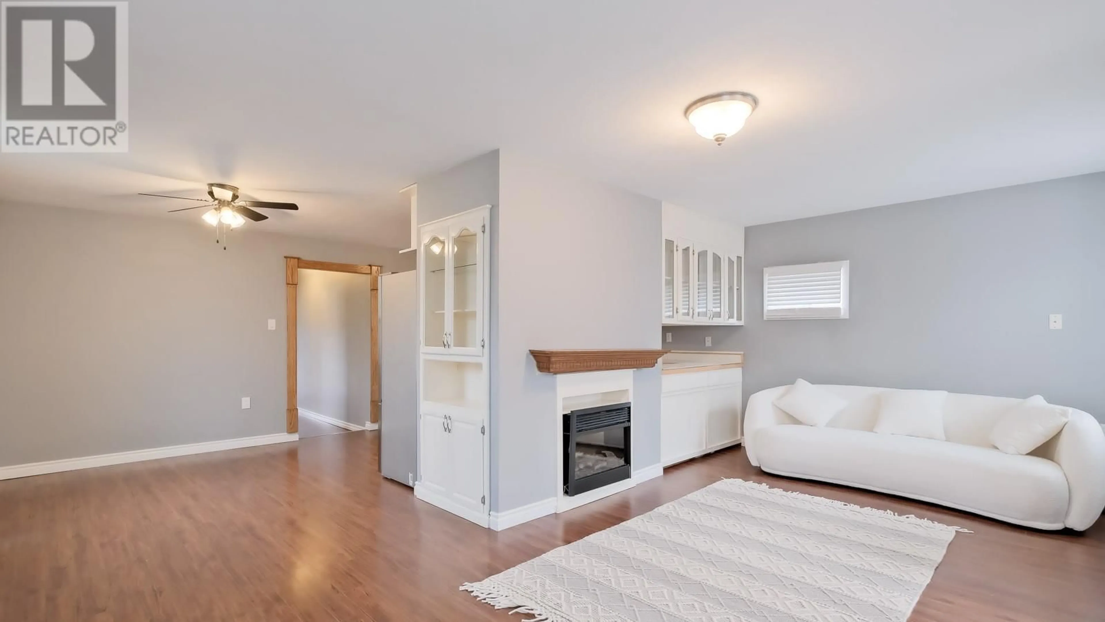 Living room with furniture, wood/laminate floor for 326 RIGSBY STREET, Penticton British Columbia V2A5S7