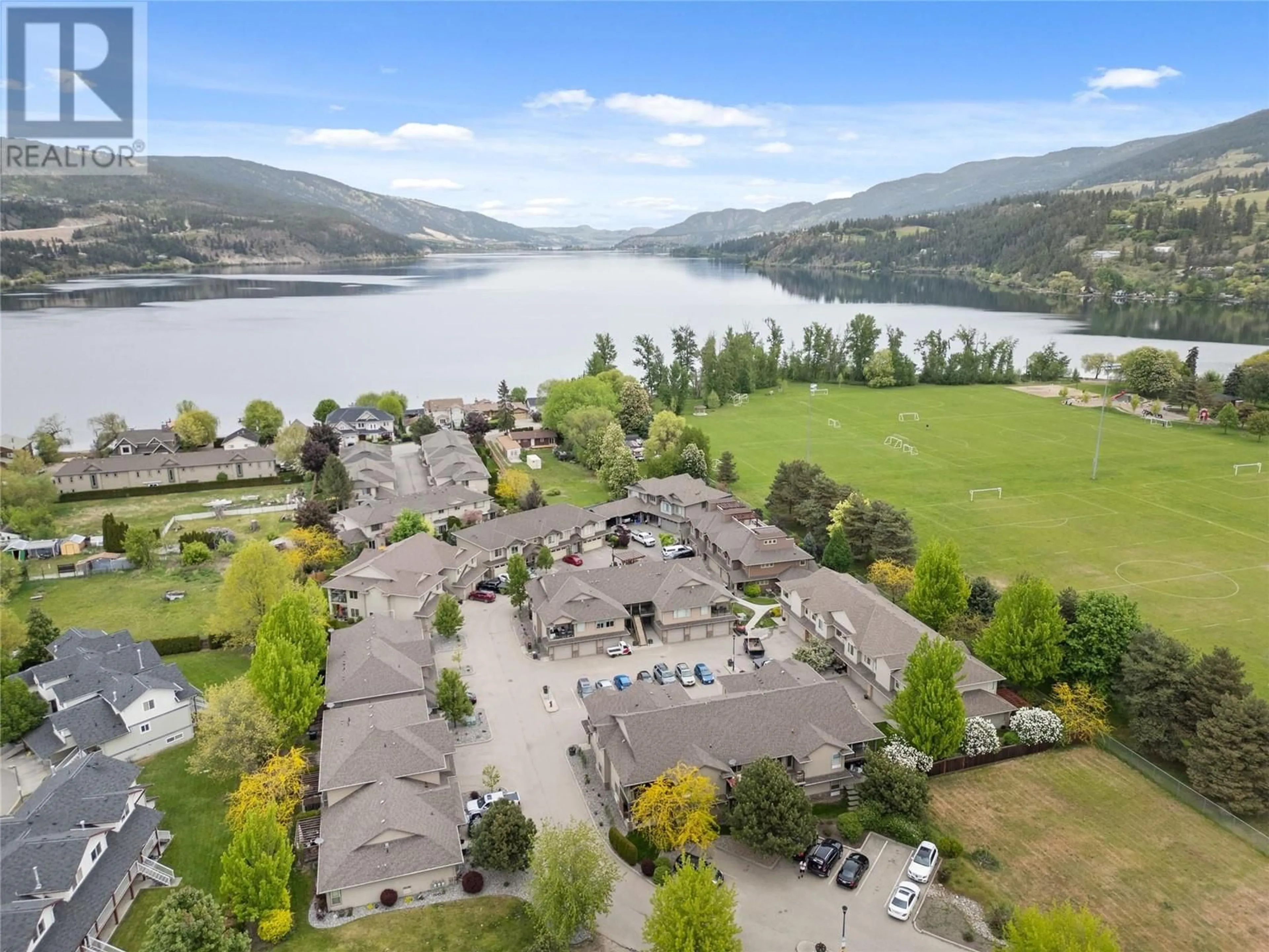 A pic from outside/outdoor area/front of a property/back of a property/a pic from drone, water/lake/river/ocean view for 406 - 3350 WOODSDALE ROAD, Lake Country British Columbia V4V2R7