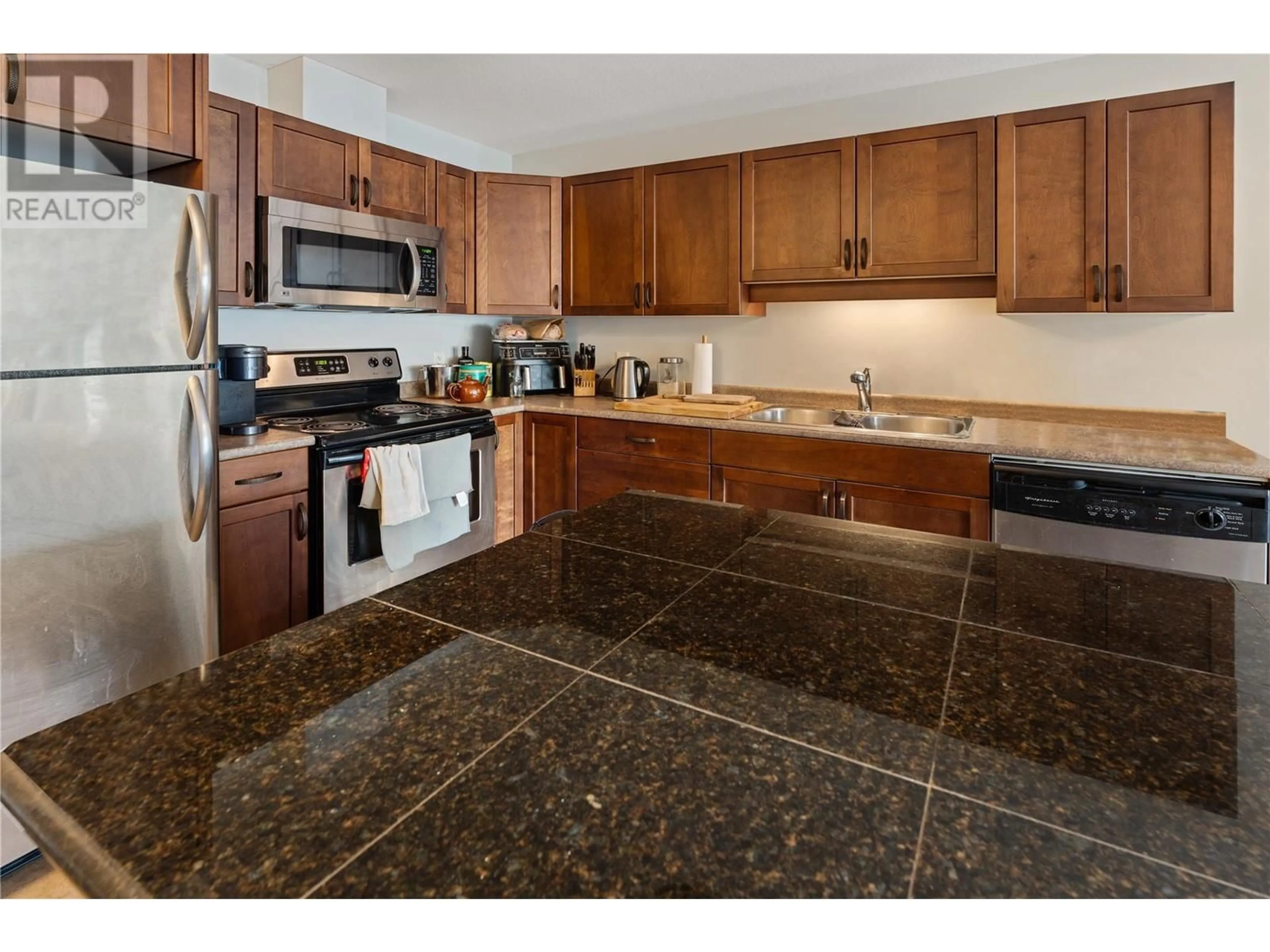 Standard kitchen, ceramic/tile floor for 406 - 3350 WOODSDALE ROAD, Lake Country British Columbia V4V2R7
