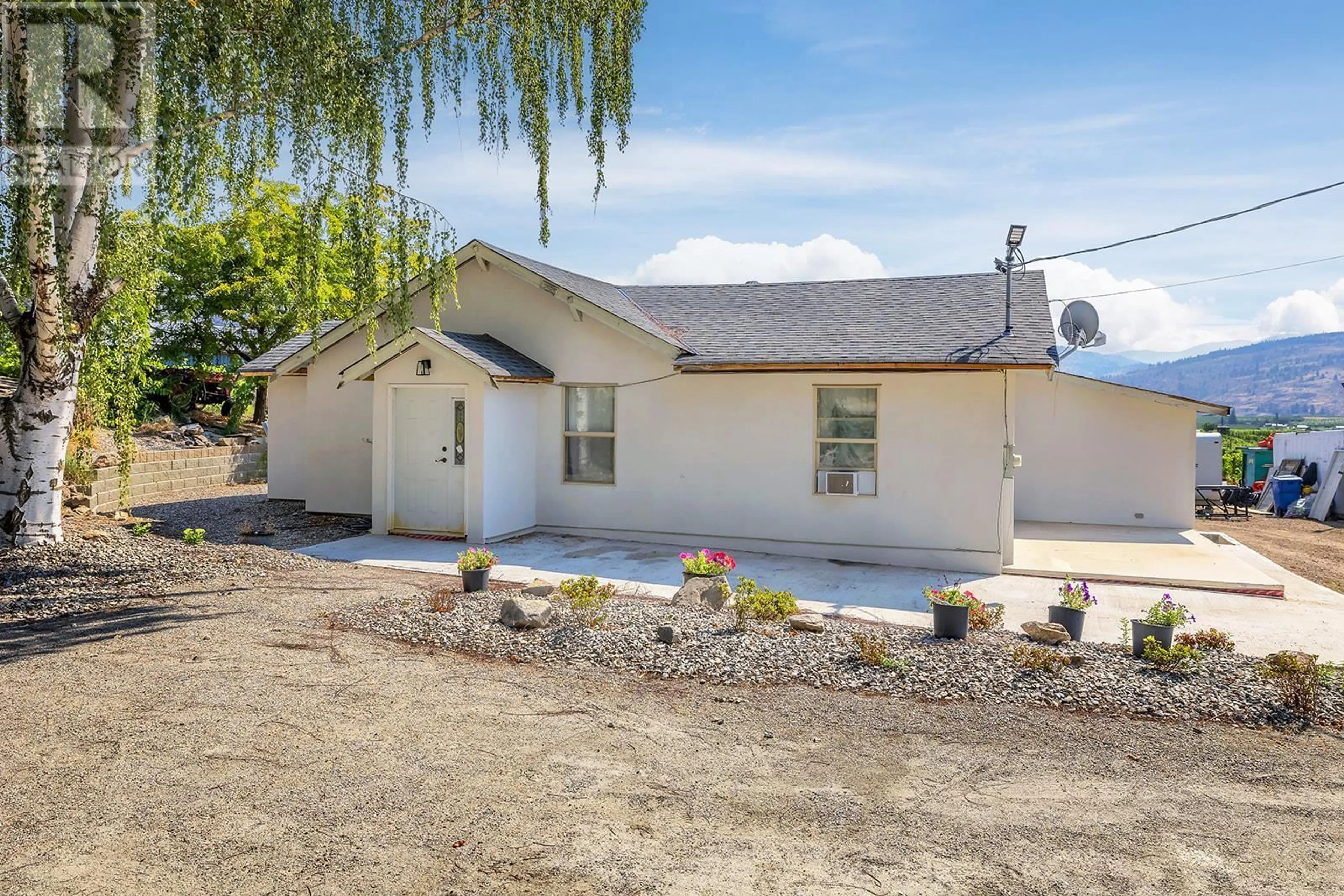 Home with vinyl exterior material, street for 5463 SUMAC STREET, Oliver British Columbia V0H1T1