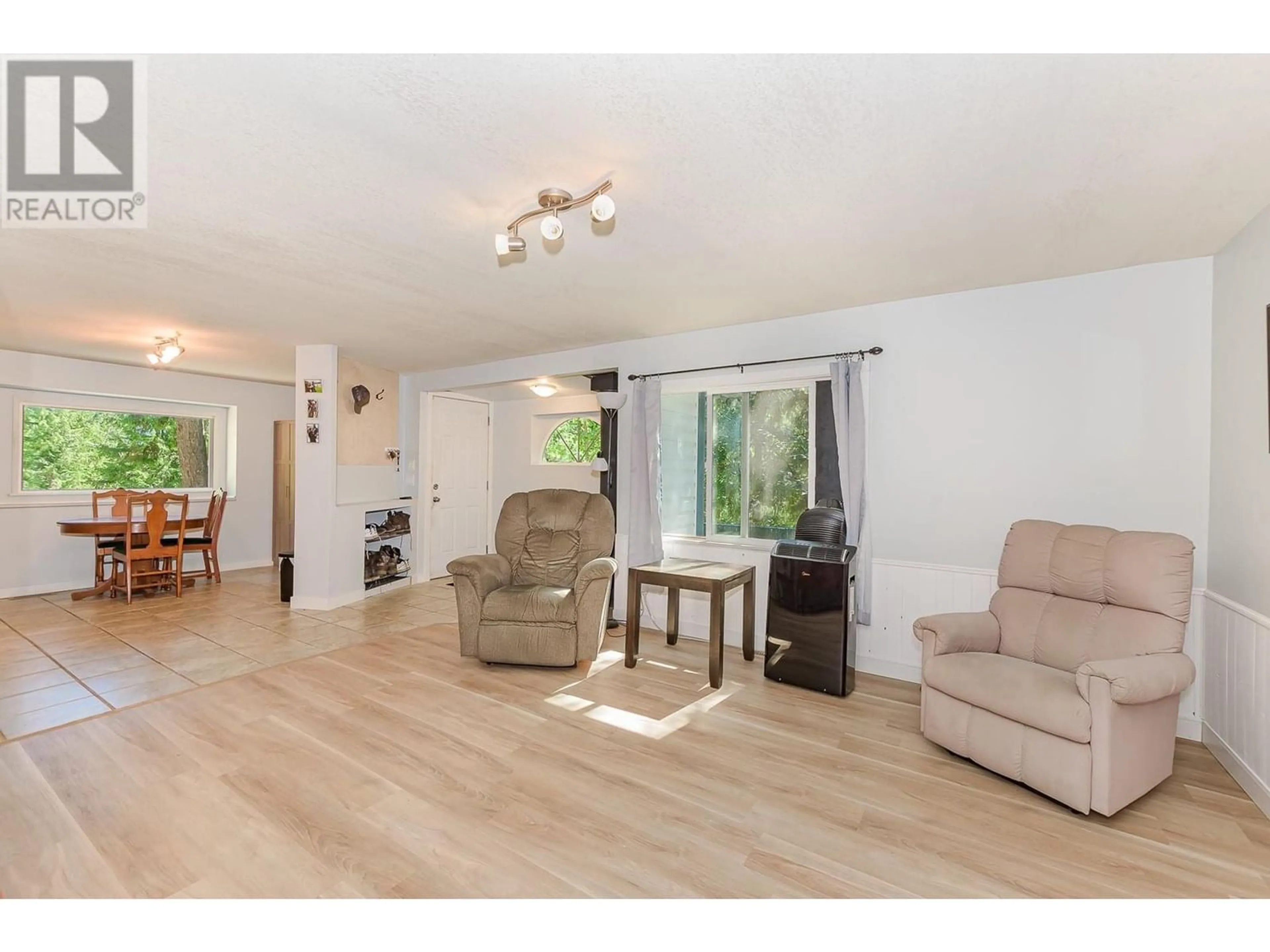 Living room with furniture, wood/laminate floor for 9 - 2036 SOLSQUA-SICAMOUS ROAD, Sicamous British Columbia V0E2V4