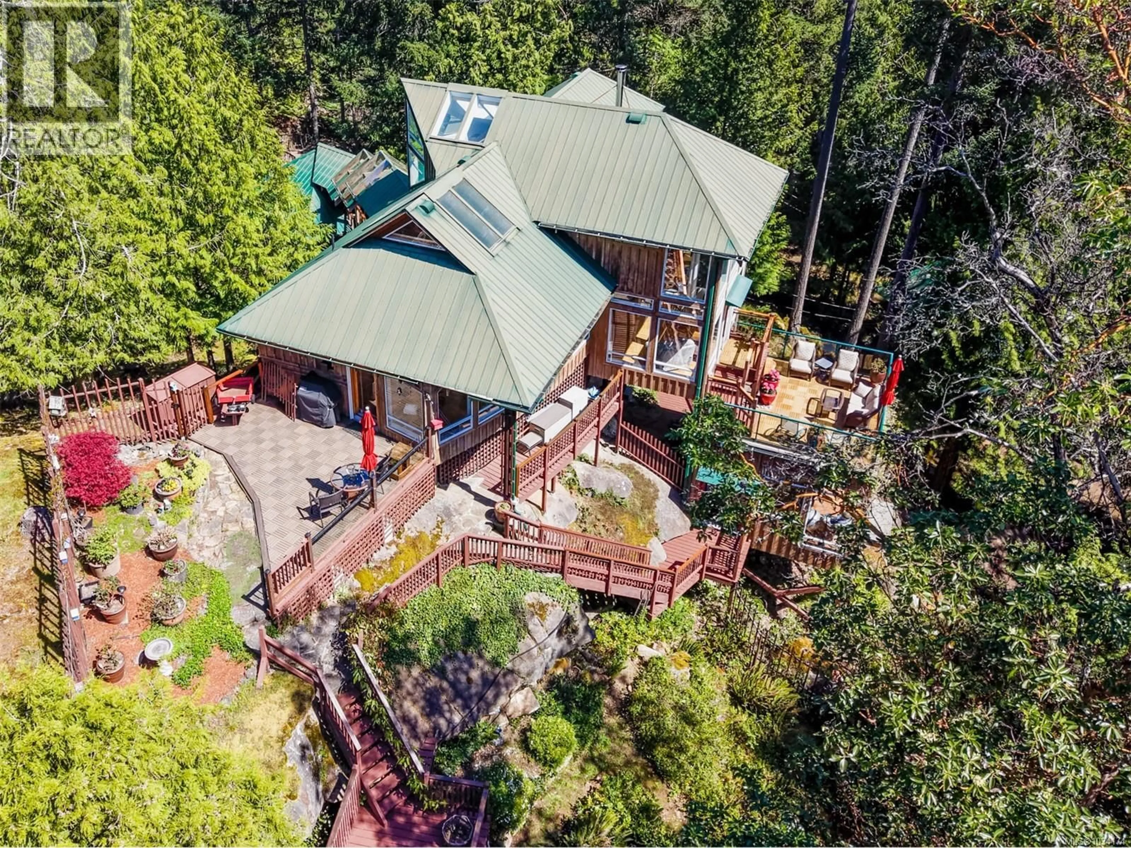 A pic from outside/outdoor area/front of a property/back of a property/a pic from drone, forest/trees view for 486 BLUFF WAY, Mayne Island British Columbia V0N2J2