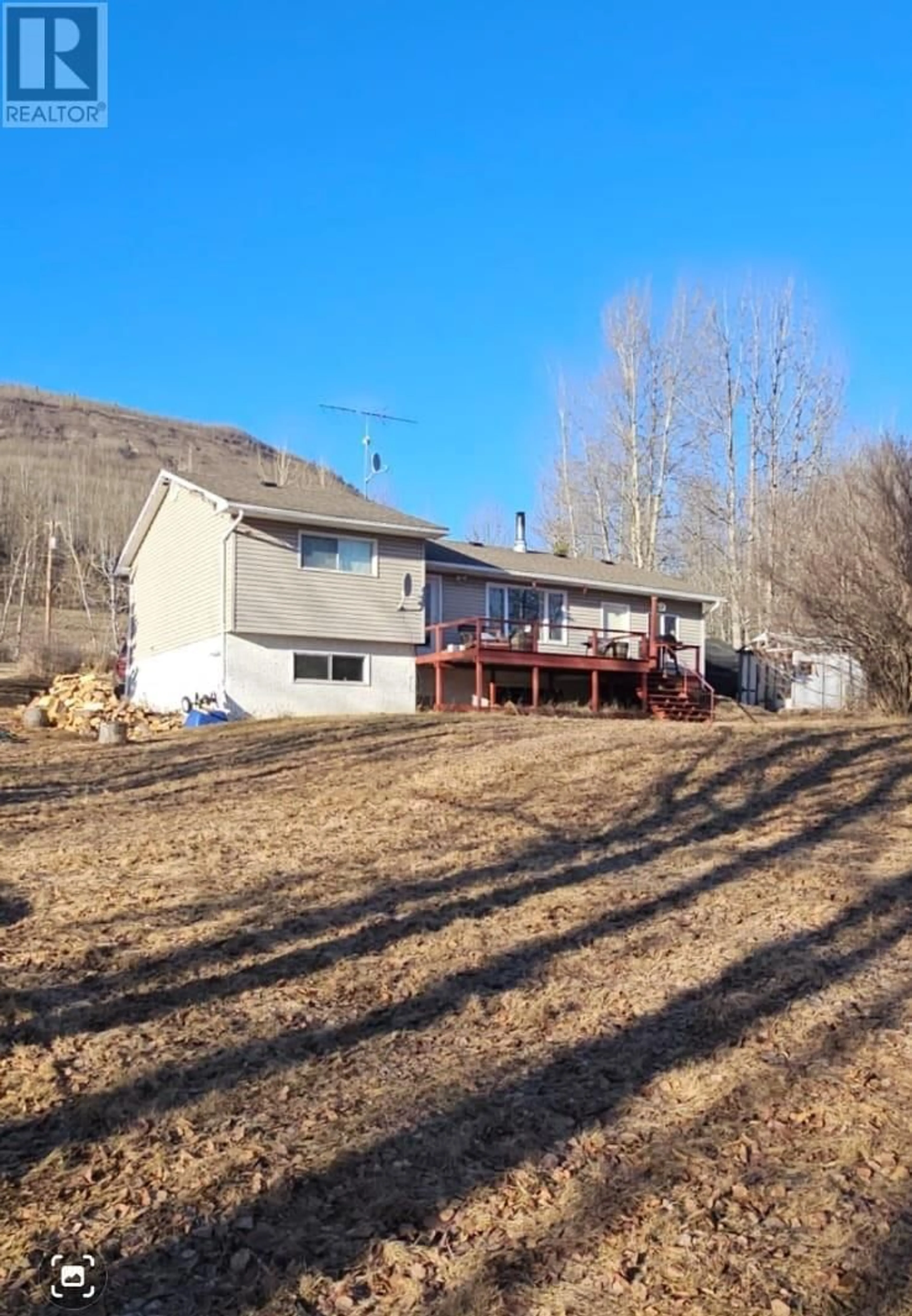 A pic from outside/outdoor area/front of a property/back of a property/a pic from drone, mountain view for 6327 WILDMARE OTHER, Chetwynd British Columbia V0C1J0