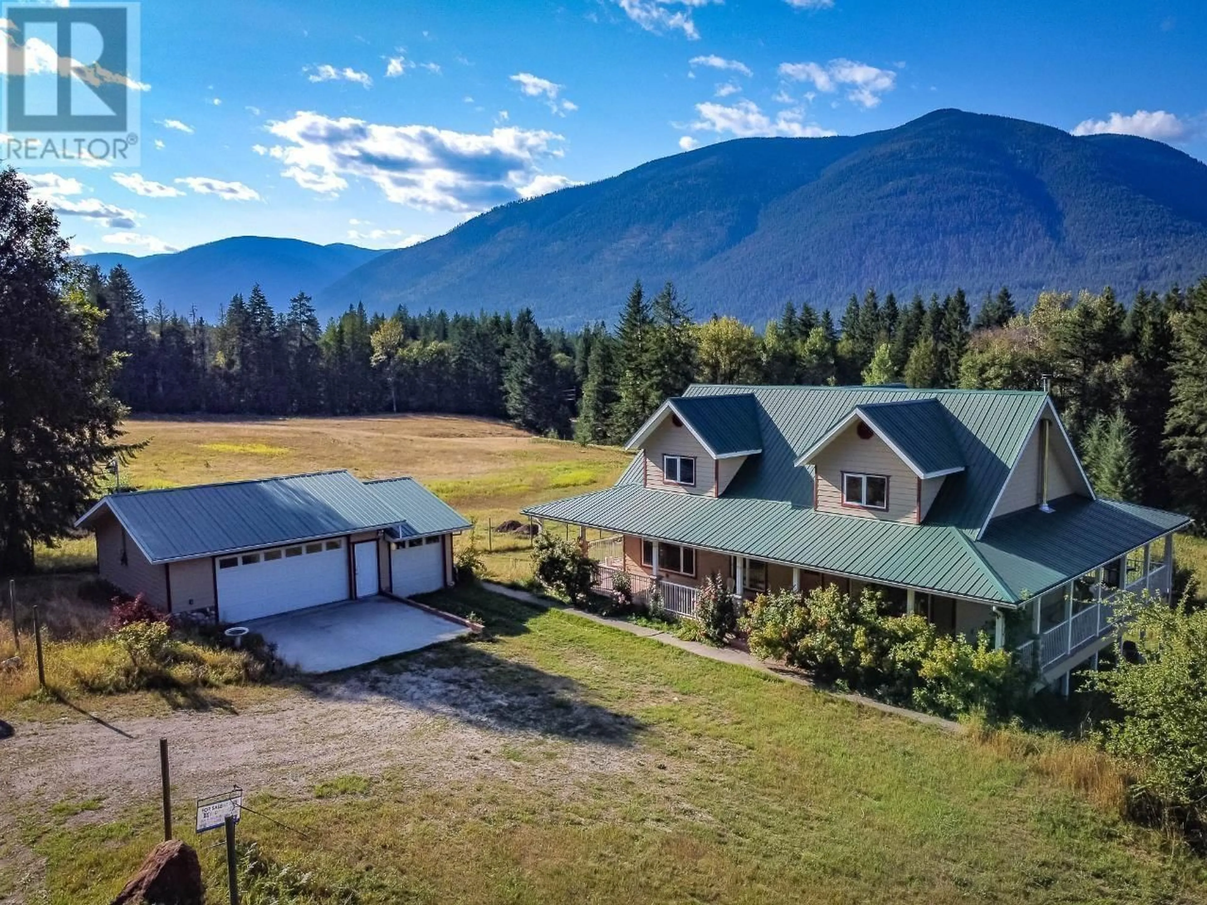 A pic from outside/outdoor area/front of a property/back of a property/a pic from drone, mountain view for 6291 MILL CREEK ROAD, Harrop British Columbia V1L6P9