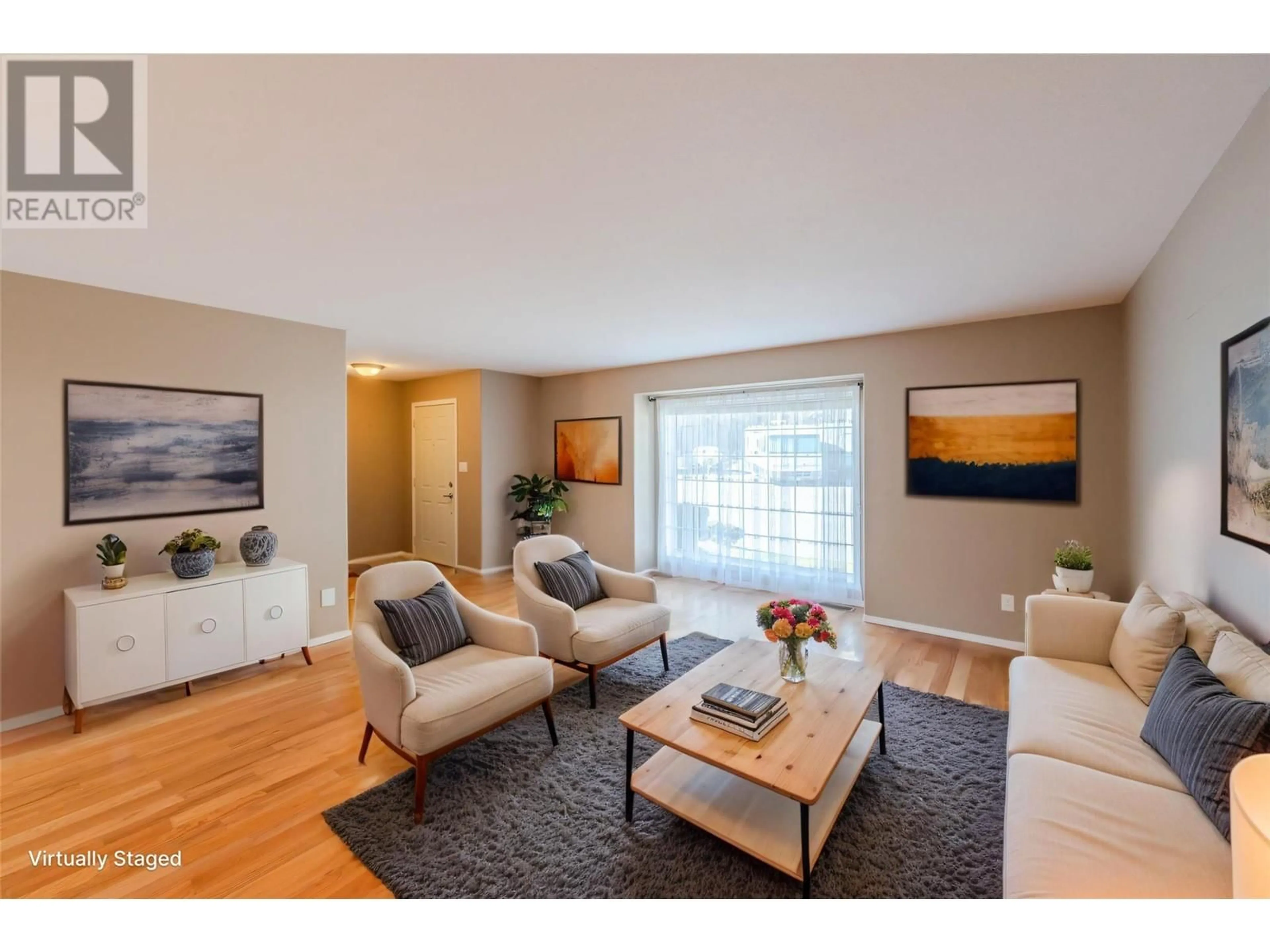 Living room with furniture, wood/laminate floor for 612 RED WING DRIVE, Penticton British Columbia V2A8N7