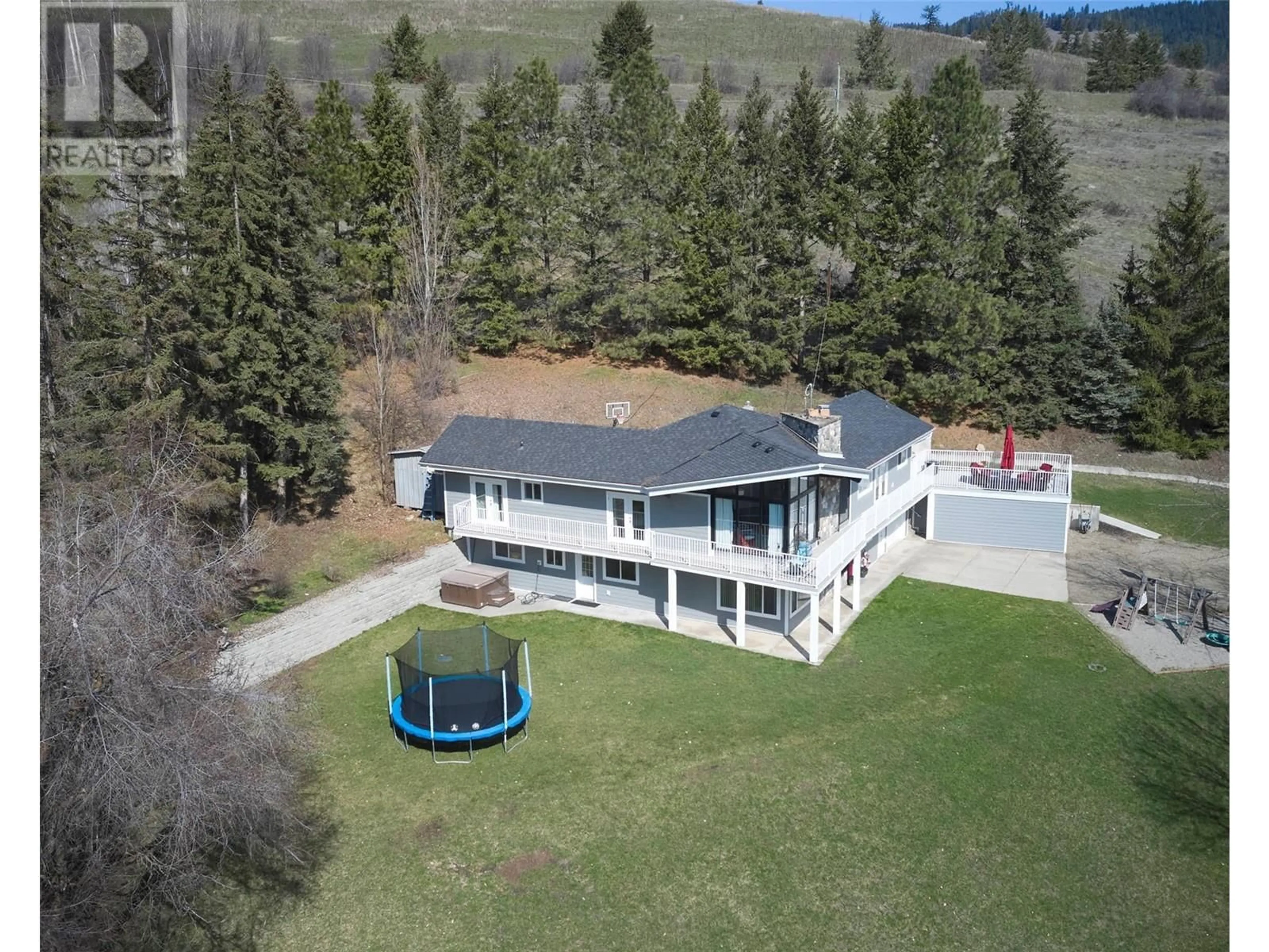 A pic from outside/outdoor area/front of a property/back of a property/a pic from drone, unknown for 5719 6 HIGHWAY, Coldstream British Columbia V1B3E1