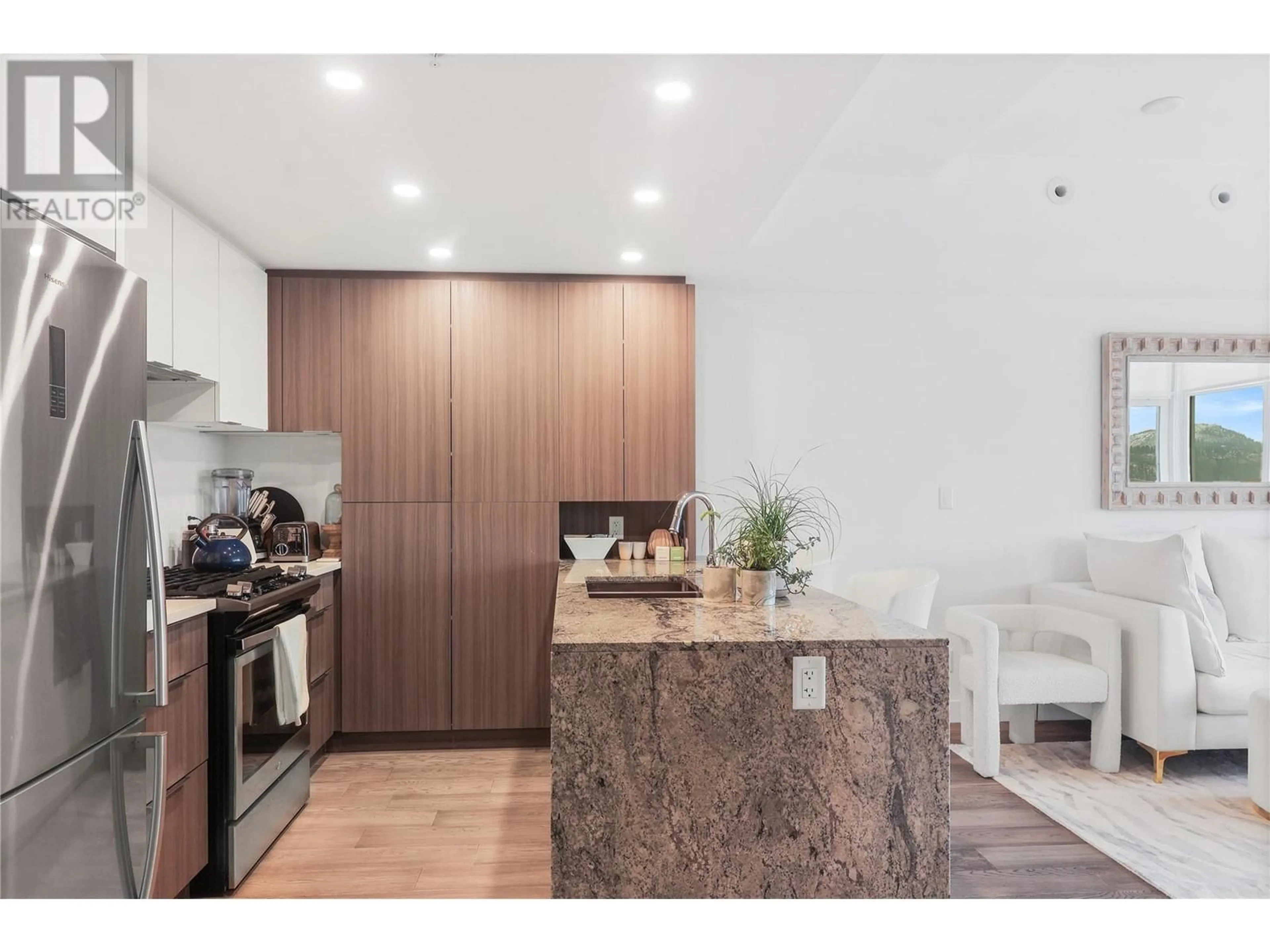 Open concept kitchen, wood/laminate floor for 1106 - 1151 SUNSET DRIVE, Kelowna British Columbia V1Y0G2