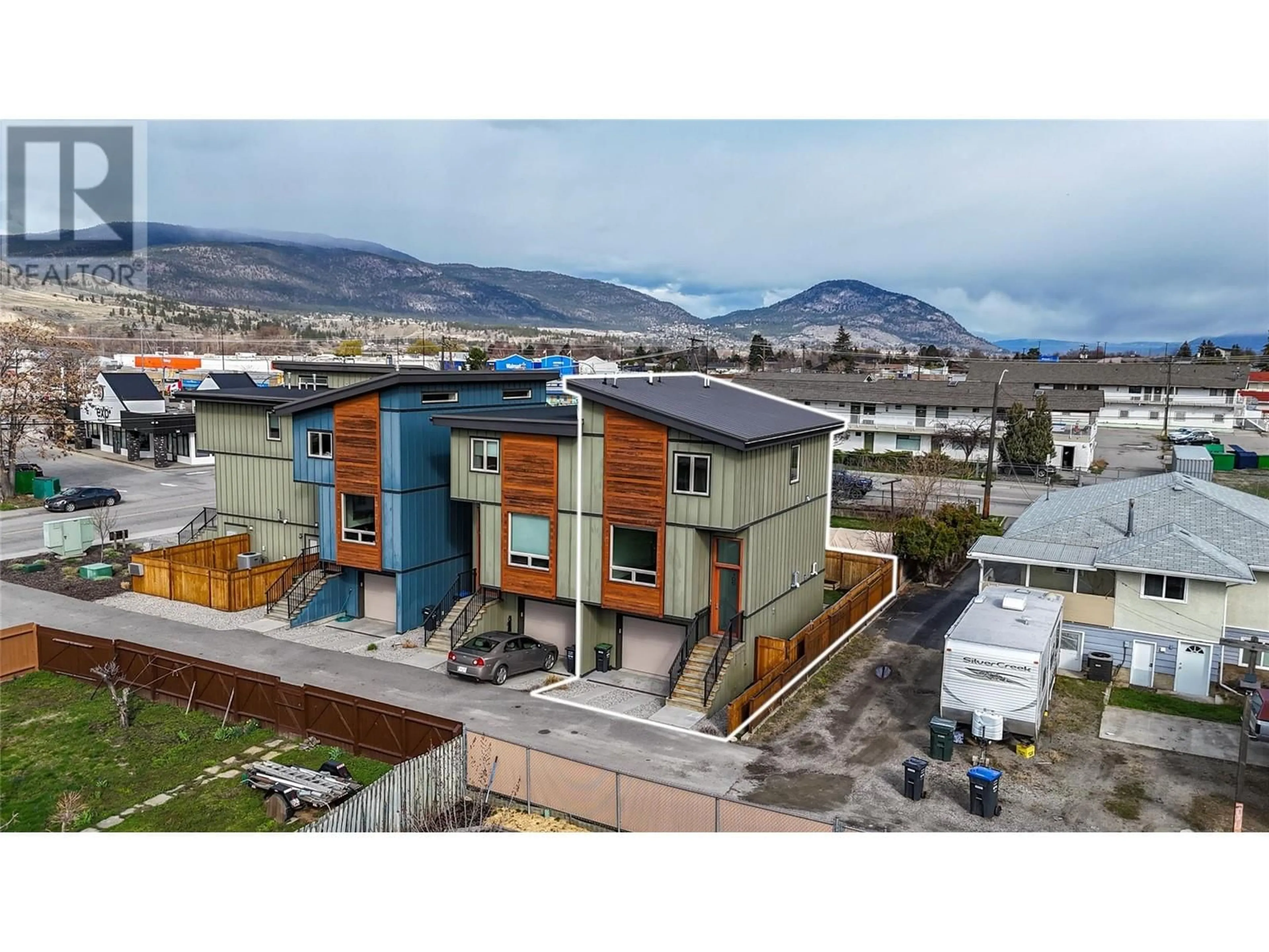 A pic from outside/outdoor area/front of a property/back of a property/a pic from drone, mountain view for 105 - 2922 WILSON STREET, Penticton British Columbia V2A6H5