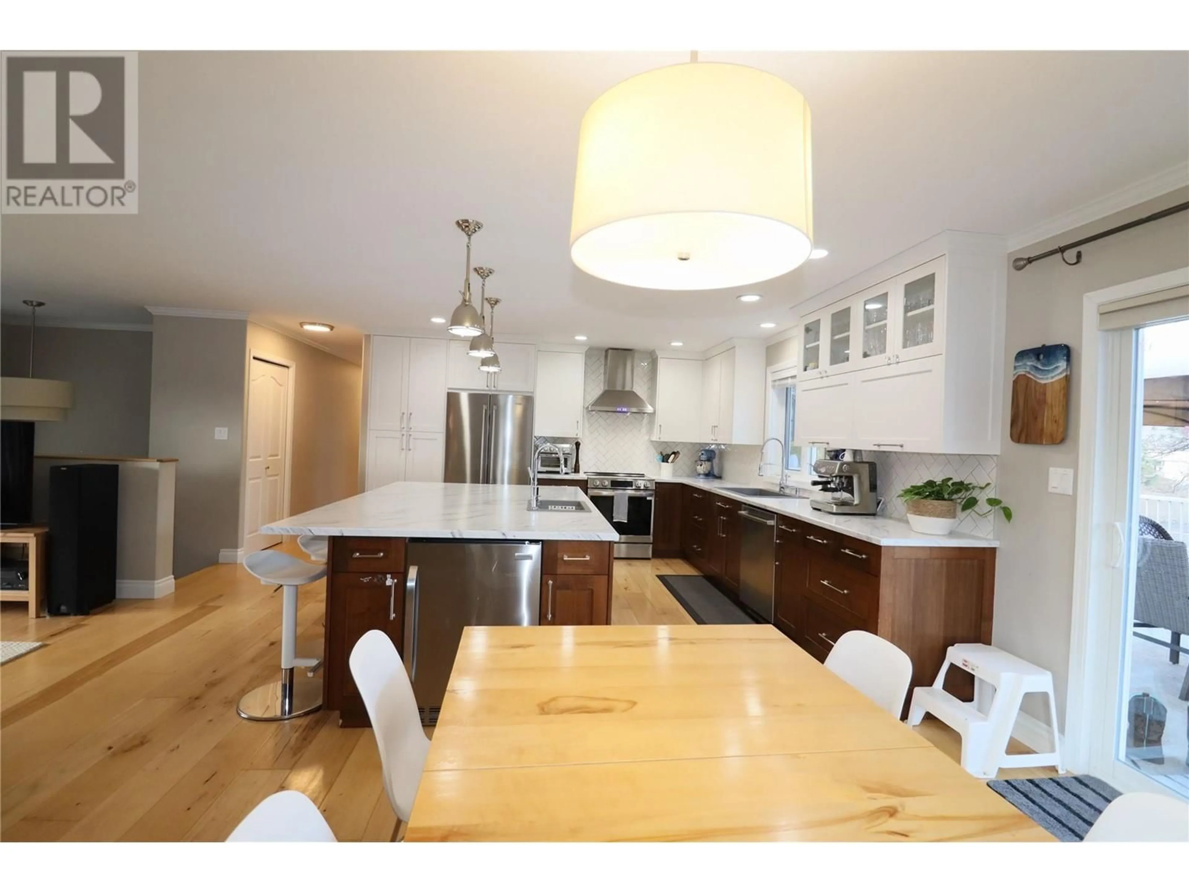 Open concept kitchen, wood/laminate floor for 2240 SELKIRK PLACE, Grand Forks British Columbia V0H1H0